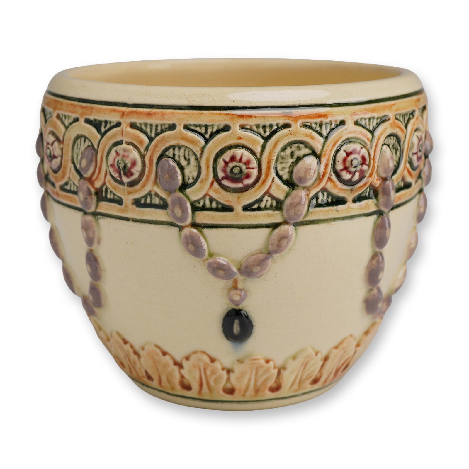 Weller Art Pottery Planter-Jardiniere, Pearl: A Weller art pottery featuring a tapered rounded form with relief-molded decoration. The exterior is finished in a cream-colored glaze and is adorned with an upper frieze of interlocking guilloche ban