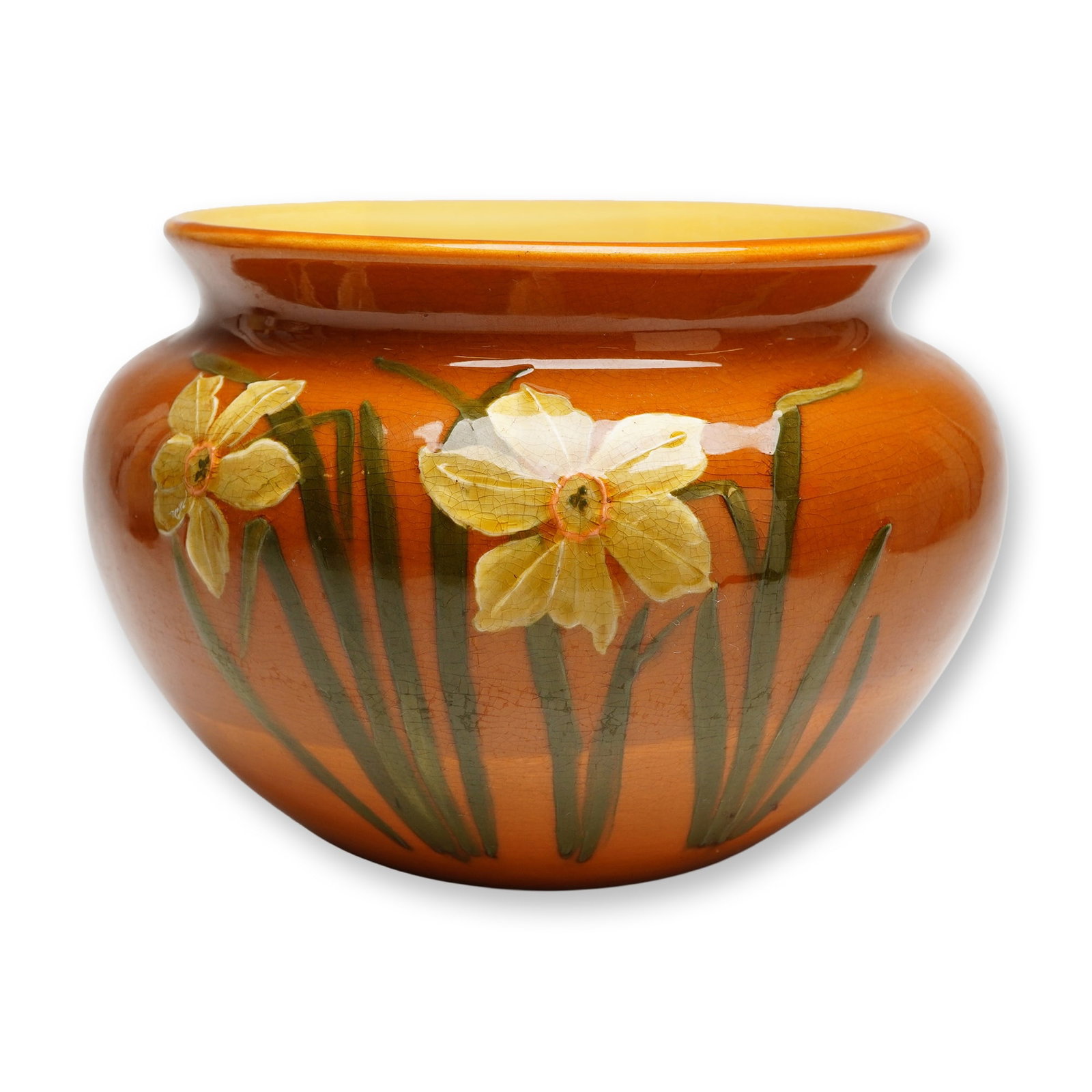 Weller Pottery Dickens Ware Jardiniere: The Weller Pottery Dickens Ware line was produced in Zanesville, Ohio, during the Art Nouveau period, circa 1900. This bulbous earthenware vessel features a wide, flared rim and is finished in a high-
