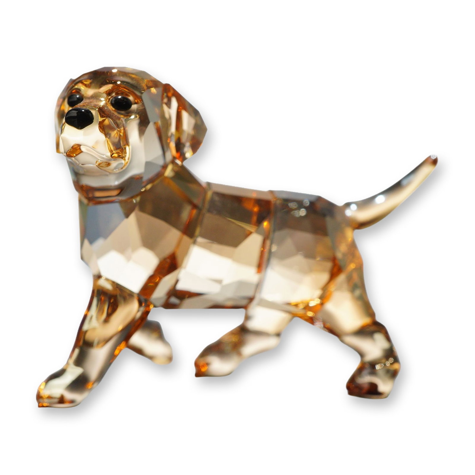Swarovski Crystal Golden Retriever Puppy Figurine: Swarovski crystal figurine depicting a standing Golden Retriever puppy, model number 1142824. The piece features a faceted golden-brown crystal body, legs, head, and tail, with applied black crystal e