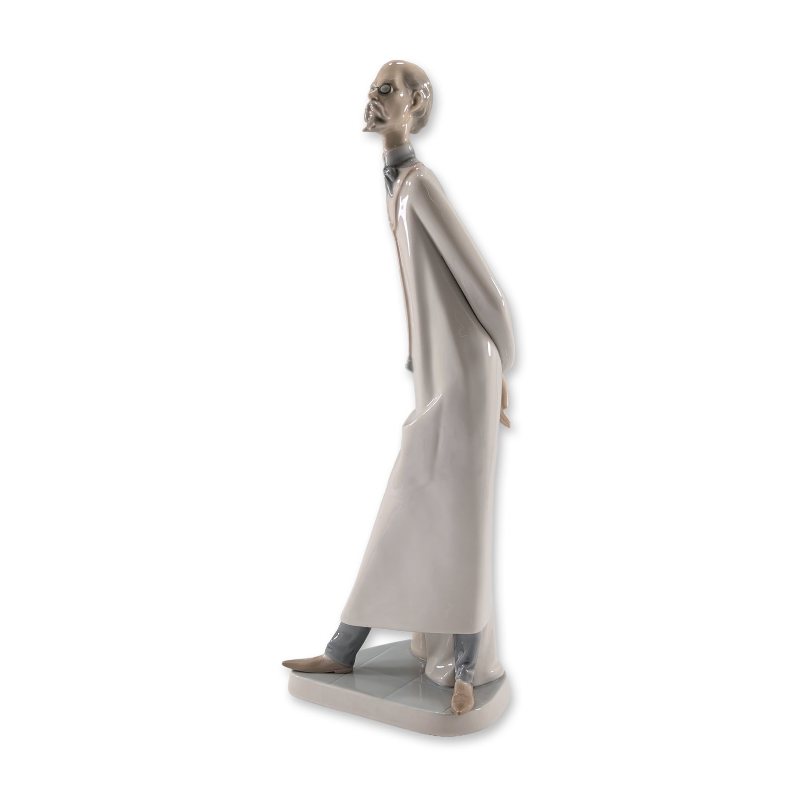 Lladro Porcelain Figurine Doctor 1004602: Lladro, Tavernes Blanques, Spain. Glazed porcelain figurine titled Doctor, model number 4602, designed by sculptor Salvador Furio. The polychrome figure features a slender man with a mustache and goat