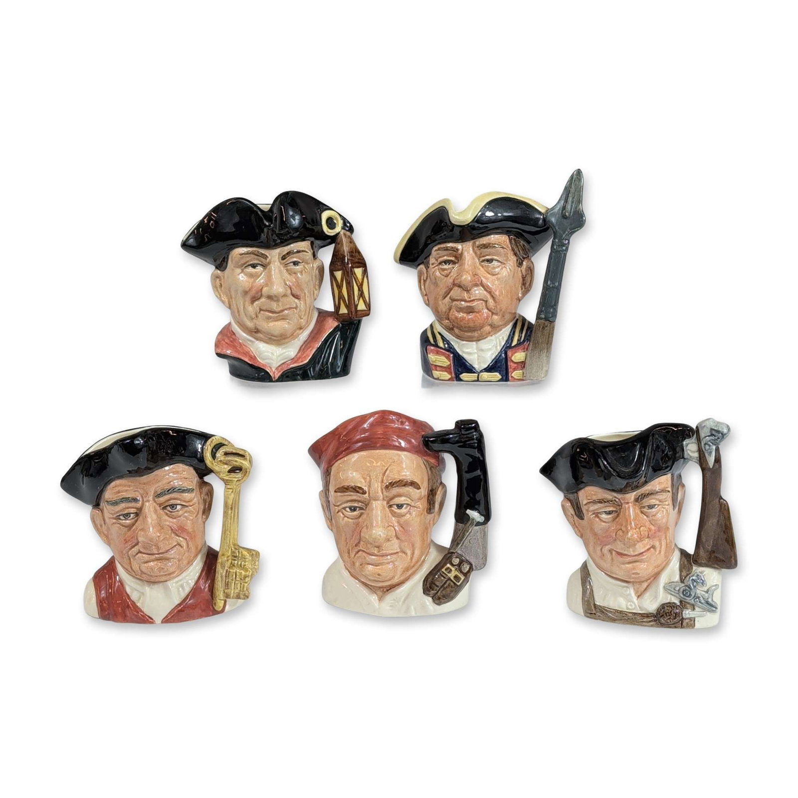 5pc Royal Doulton Character Jugs: Group of five Royal Doulton character jugs, manufactured in England. Each jug is constructed of glazed ceramic with detailed polychrome decoration. The underside of each base bears the green printed R