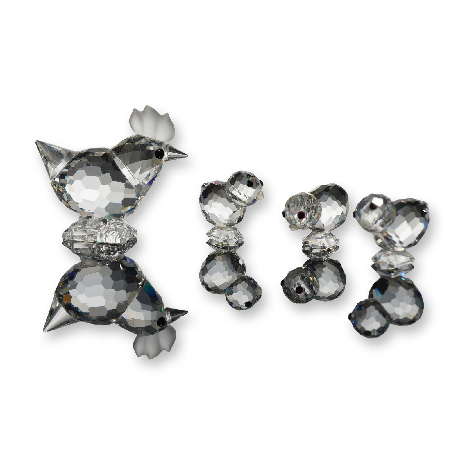 2pc Swarovski Silver Crystal Hen and Chickens: Swarovski. 3pc Swarovski Silver Crystal figurines comprising a hen and chickens, each crafted from faceted clear lead crystal with black bead eye accents. The hen features a frosted crystal comb. Ever