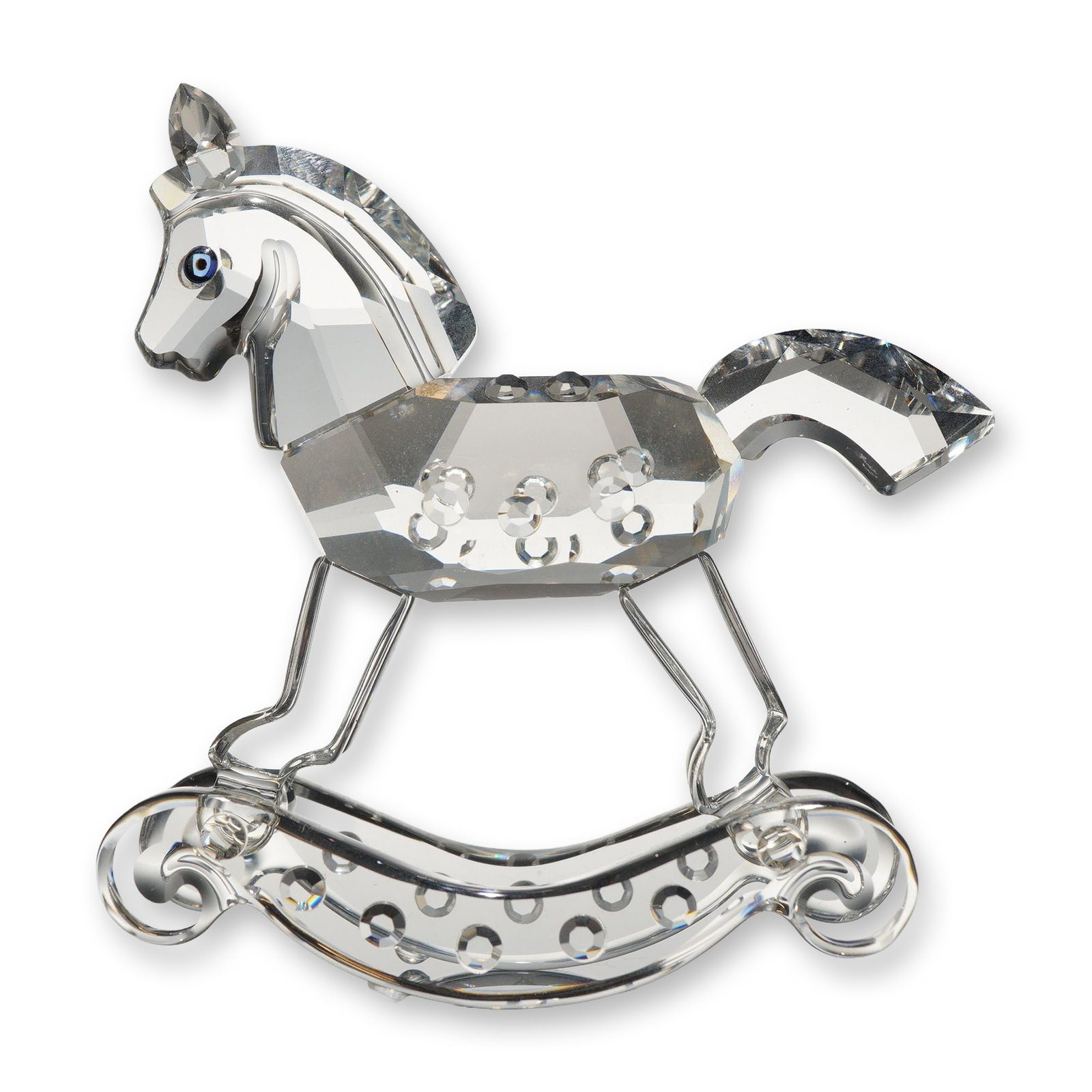 Swarovski Crystal Rocking Horse Figurine: Swarovski Silver Crystal rocking horse figurine, featuring a faceted clear crystal body detailed with circular indentations along the sides, a smooth-sculpted head and neck with a faceted mane, blue c