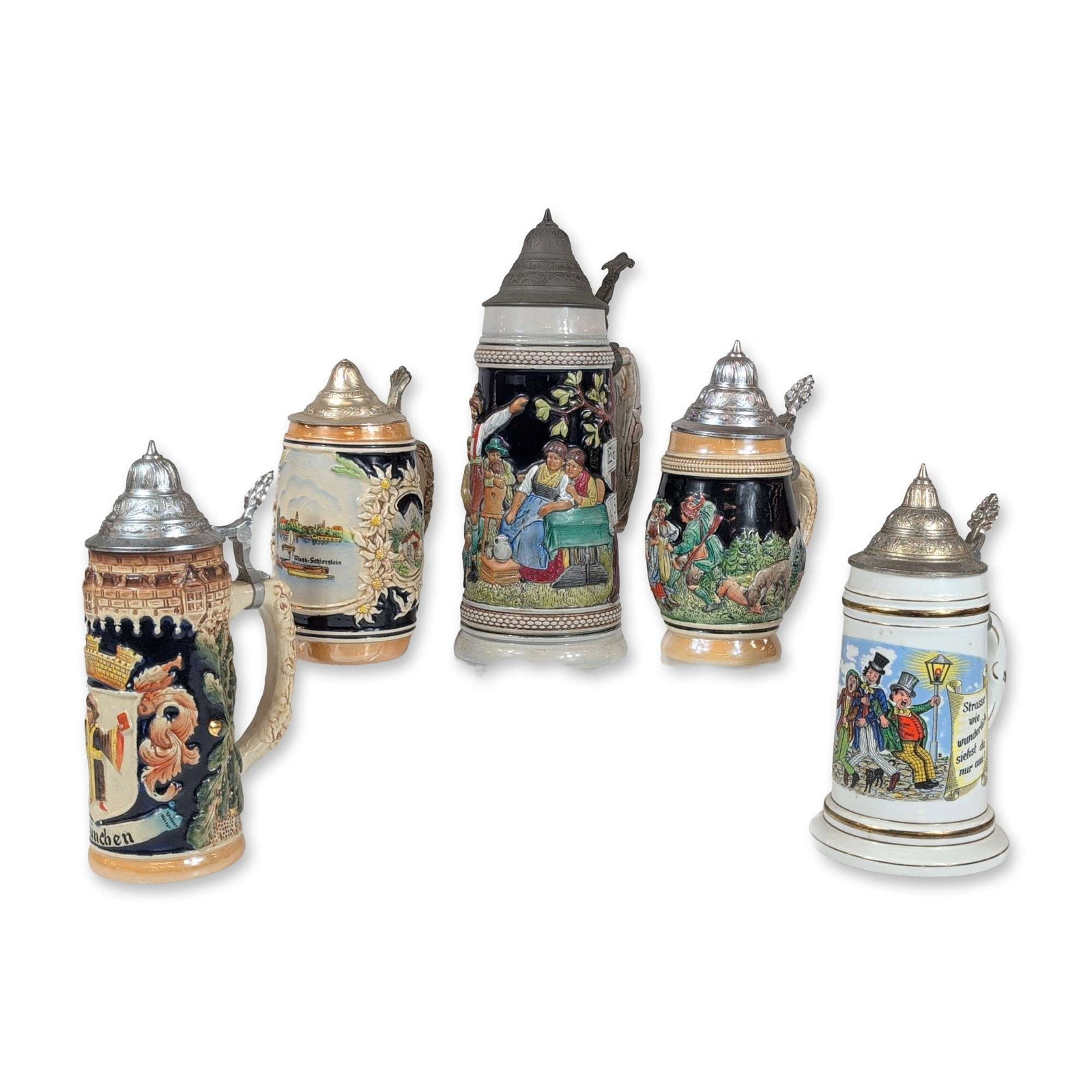 5pc German Lidded Beer Steins: Collection of five German beer steins in various sizes and styles, mid-to-late 20th century. The grouping features four relief-molded stoneware examples and one porcelain example, all with metal lids 