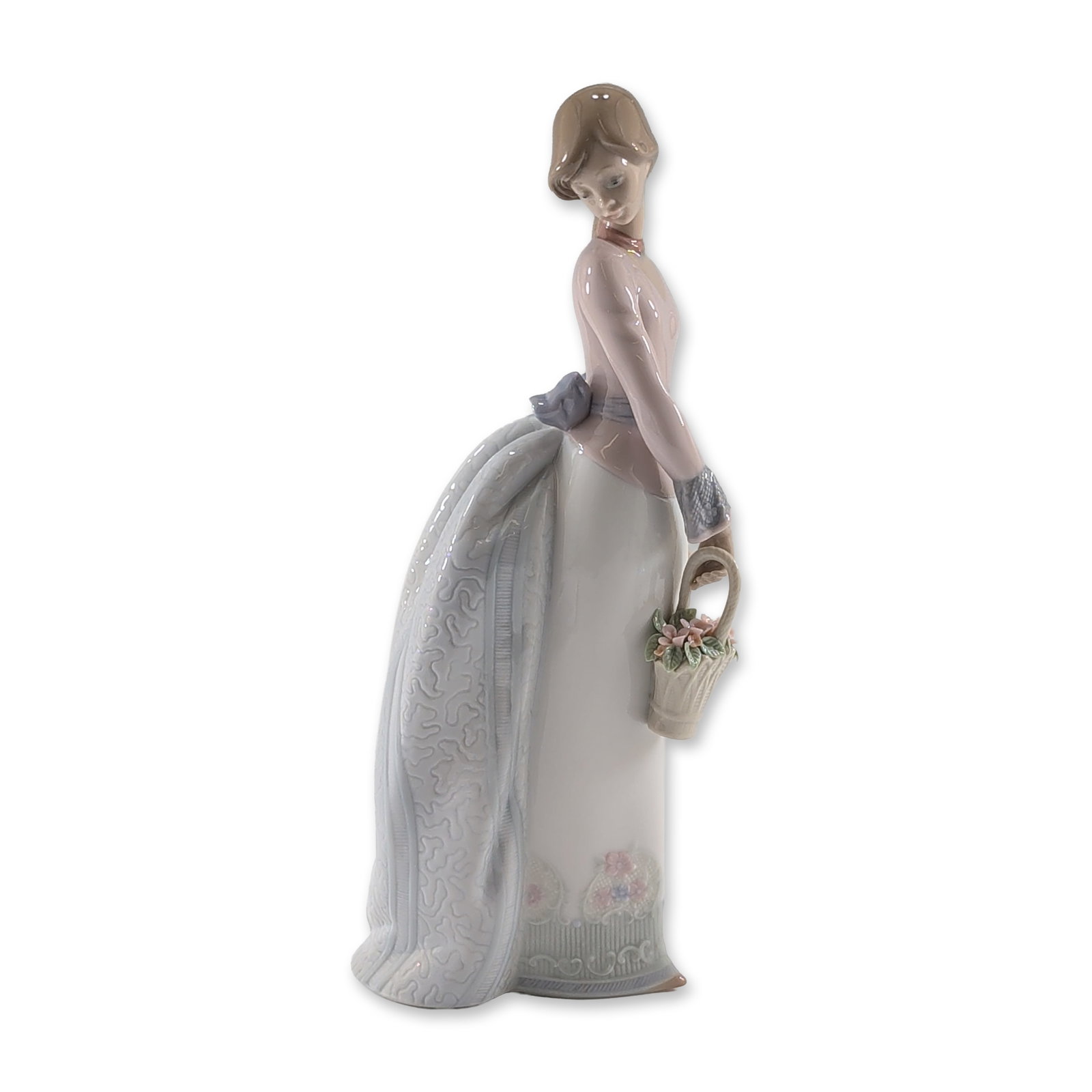 Lladro Spanish Porcelain Basket of Love Figurine: Lladro Spanish glazed porcelain figurine titled Basket of Love, model number 7622. The figure depicts an elegant woman in a standing pose wearing a high-waisted pale lavender-pink bodice with lacy cuf