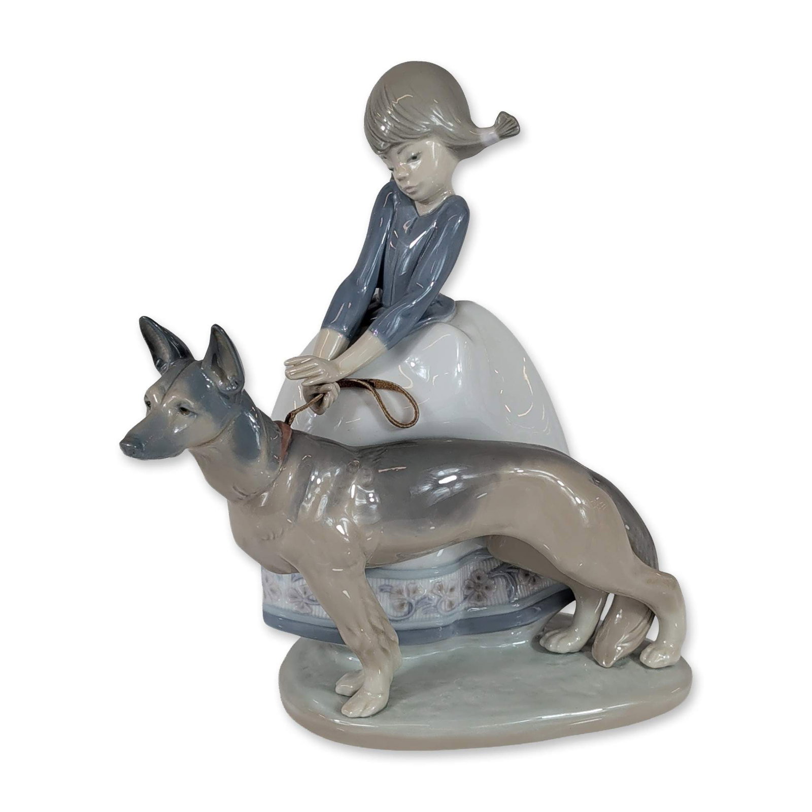 Lladro Spanish Porcelain Figurine, Not So Fast 10100533: Lladro Spanish porcelain figurine titled Not So Fast, model number 1533, designed by sculptor Juan Huerta. The glazed polychrome piece depicts a young girl with pigtails wearing a blue long-sleeved bl
