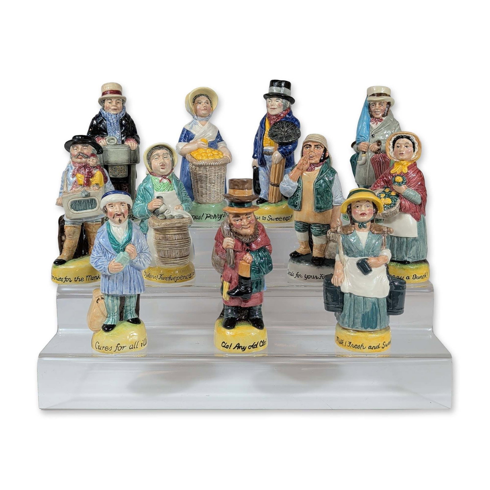 11pc Franklin Porcelain Cries of London Toby Jugs: Franklin Porcelain. Set of twelve miniature Toby jugs from the Cries of London series, dated 1980. Glazed polychrome porcelain construction. Each figure depicts a historical London street vendor with 