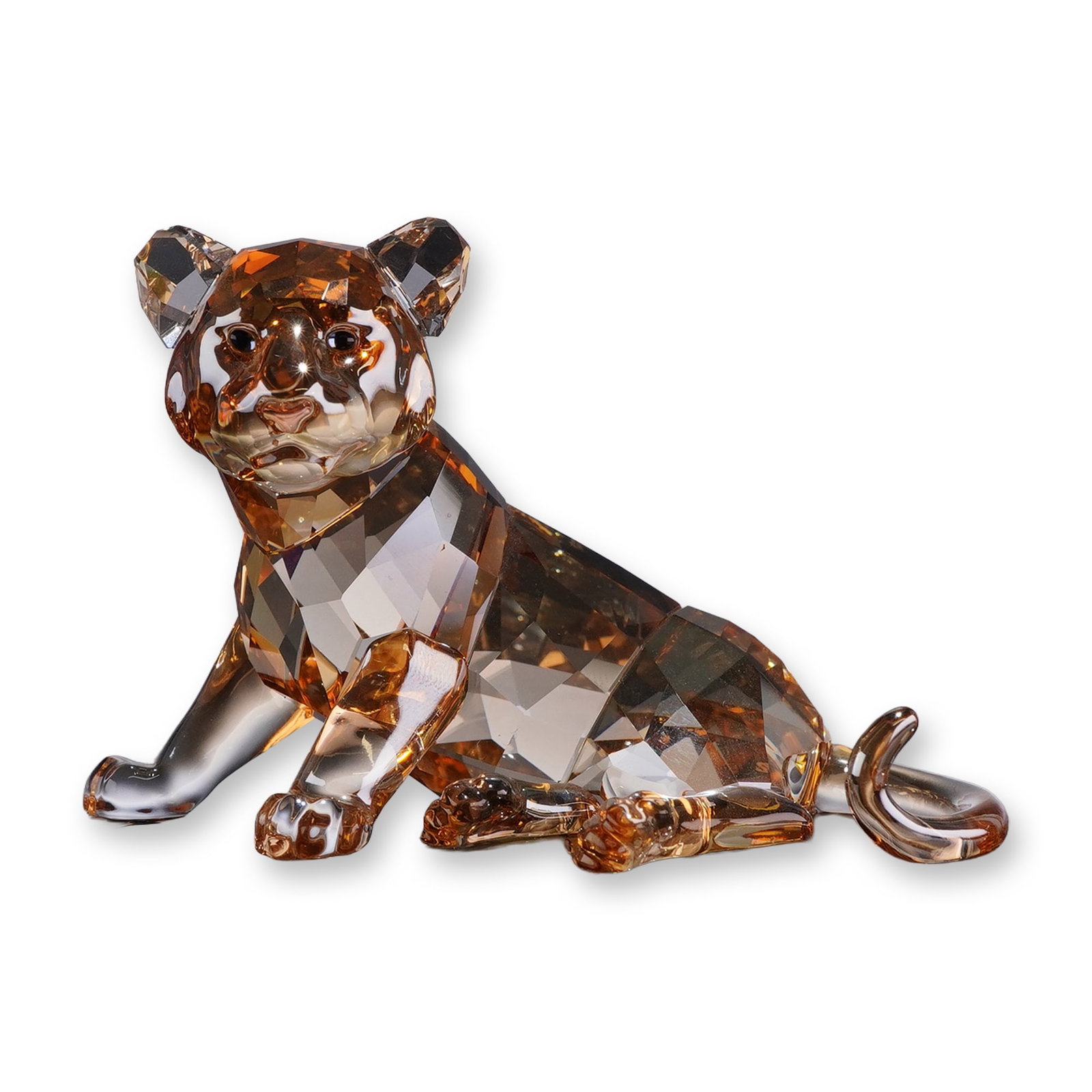 Swarovski SCS 2010 Annual Edition Figurine, Tiger Cub Sitting: Swarovski Crystal Society (SCS) lead crystal figurine depicting a sitting tiger cub, designed by Elisabeth Adamer for the 2010 annual edition series. The cub is modeled in a seated pose with its head 