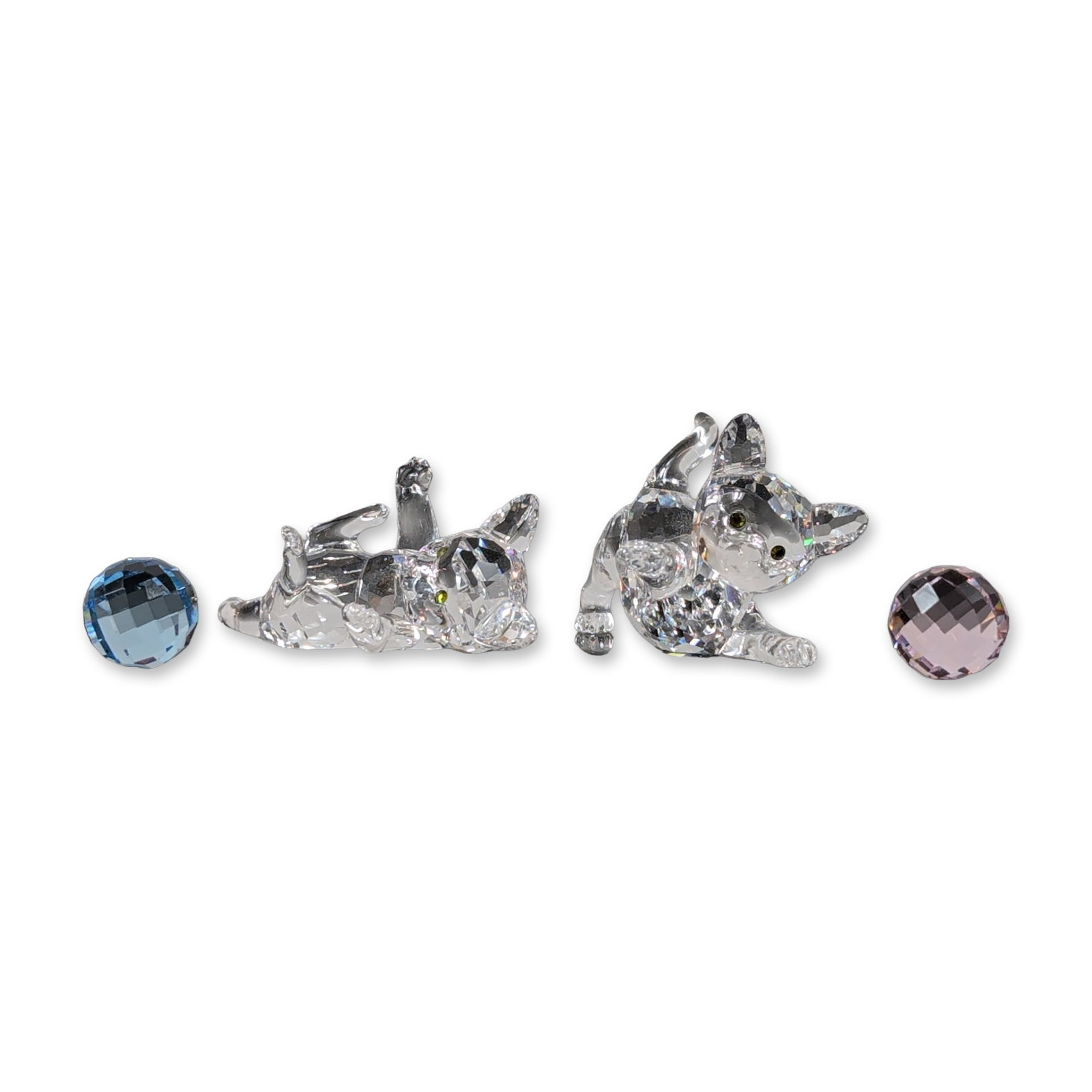 4pc Swarovski Crystal Figurines, Kittens with Balls of Yarn: Swarovski collection of faceted crystal featuring two clear cat figurines playing with two colored balls. The feline figures are depicted in playful poses, each accented with dark inset eyes. Swarovsk