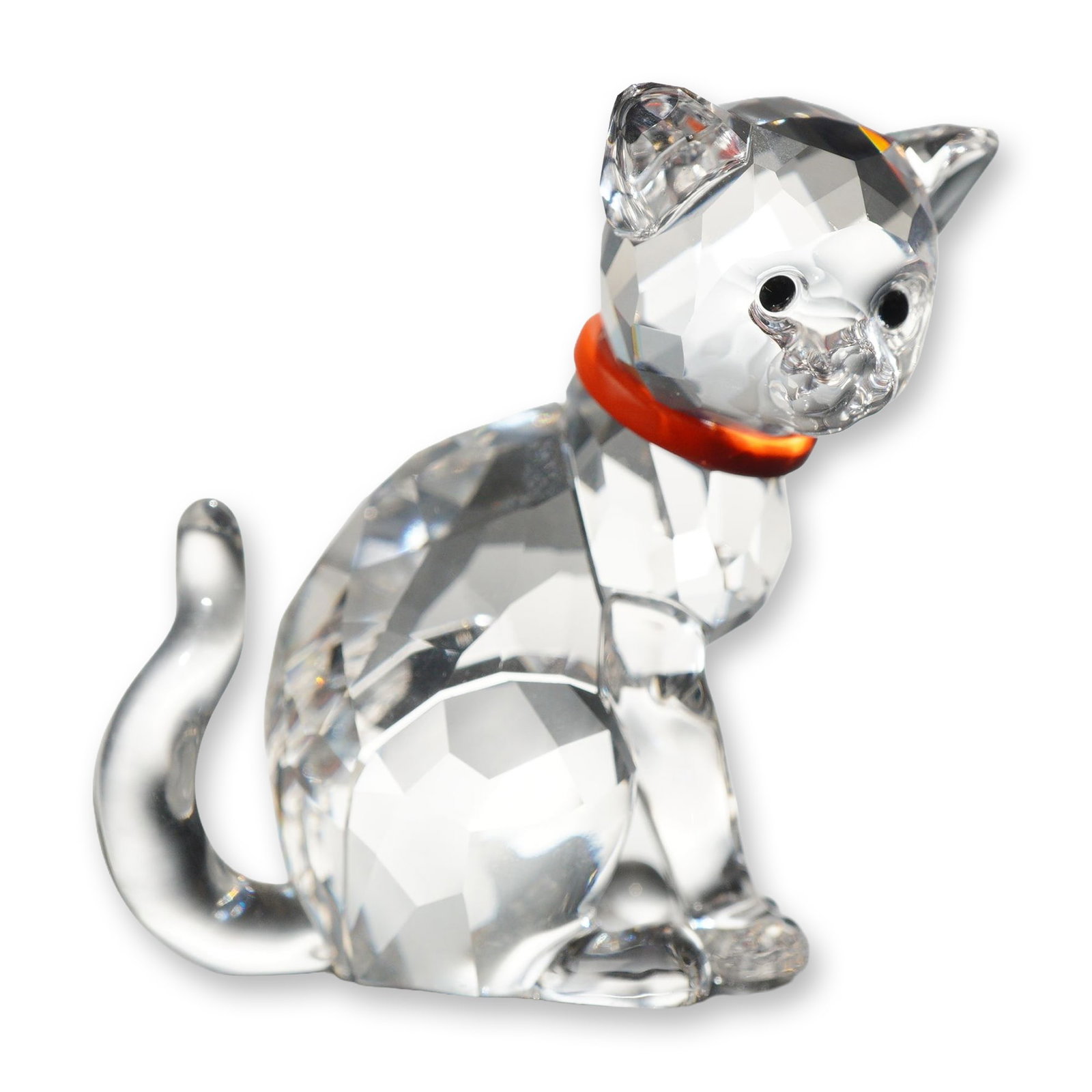 Swarovski Crystal Cat Mother Figurine: Swarovski crystal Cat Mother figurine, featuring a faceted clear crystal body and head, smooth molded ears and paws, and an arched, smooth tail. The figure is detailed with black crystal eyes and an o