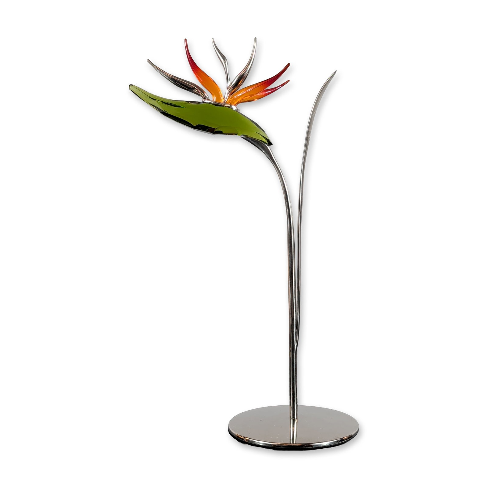 Swarovski Crystal Figurine Paradise Flowers Dalmally Tropic Sun: Flower sculpture from the Paradise collection in faceted crystal and polished metal. The piece features a green faceted crystal bract supporting a crest of orange-to-red gradient glass petals and silv