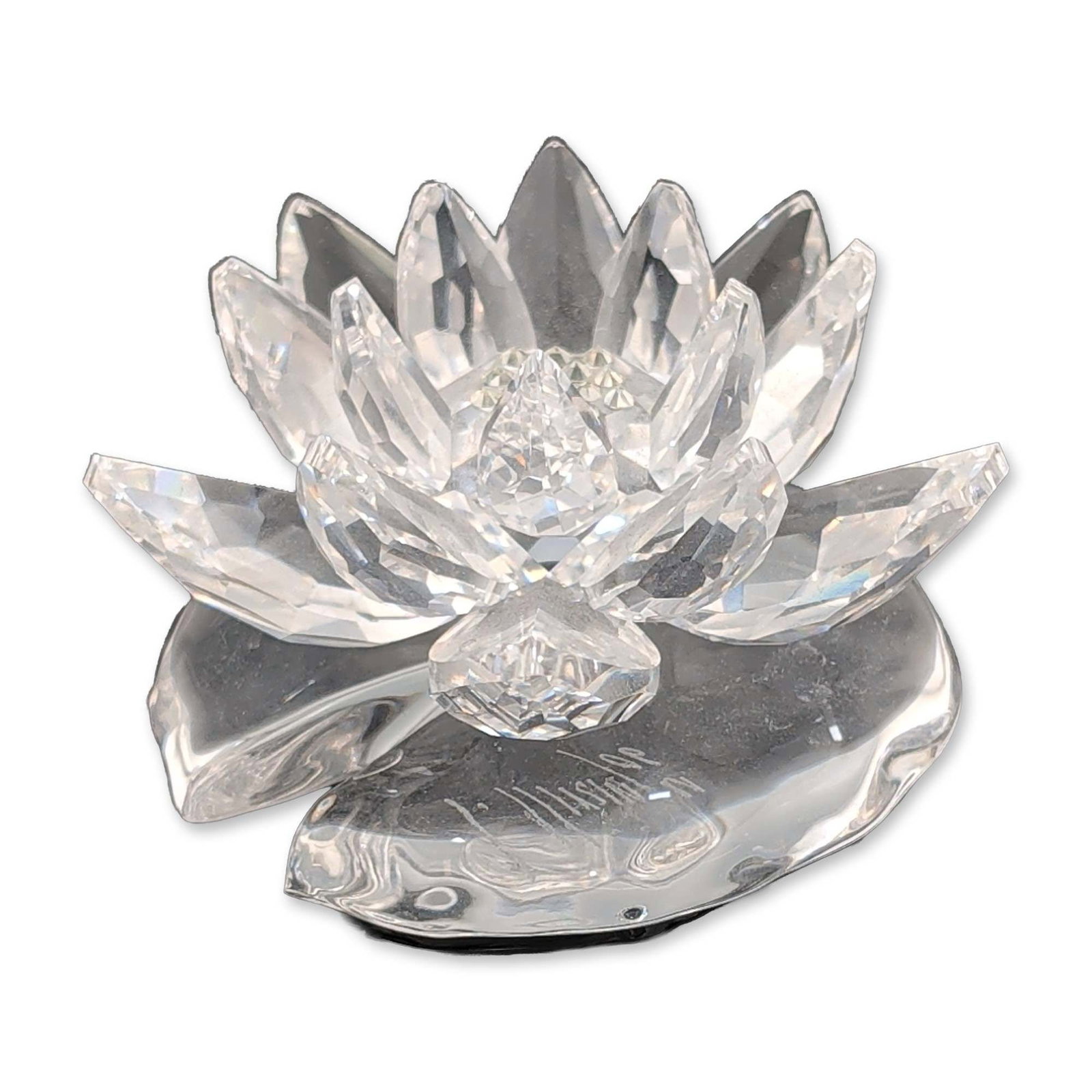 Swarovski Crystal Figurine, Large Water Lily: Swarovski faceted clear lead crystal water lily figurine designed by Anton Hirzinger. The stylized flower is composed of multiple tiers of faceted petals radiating from a textured center, mounted on a