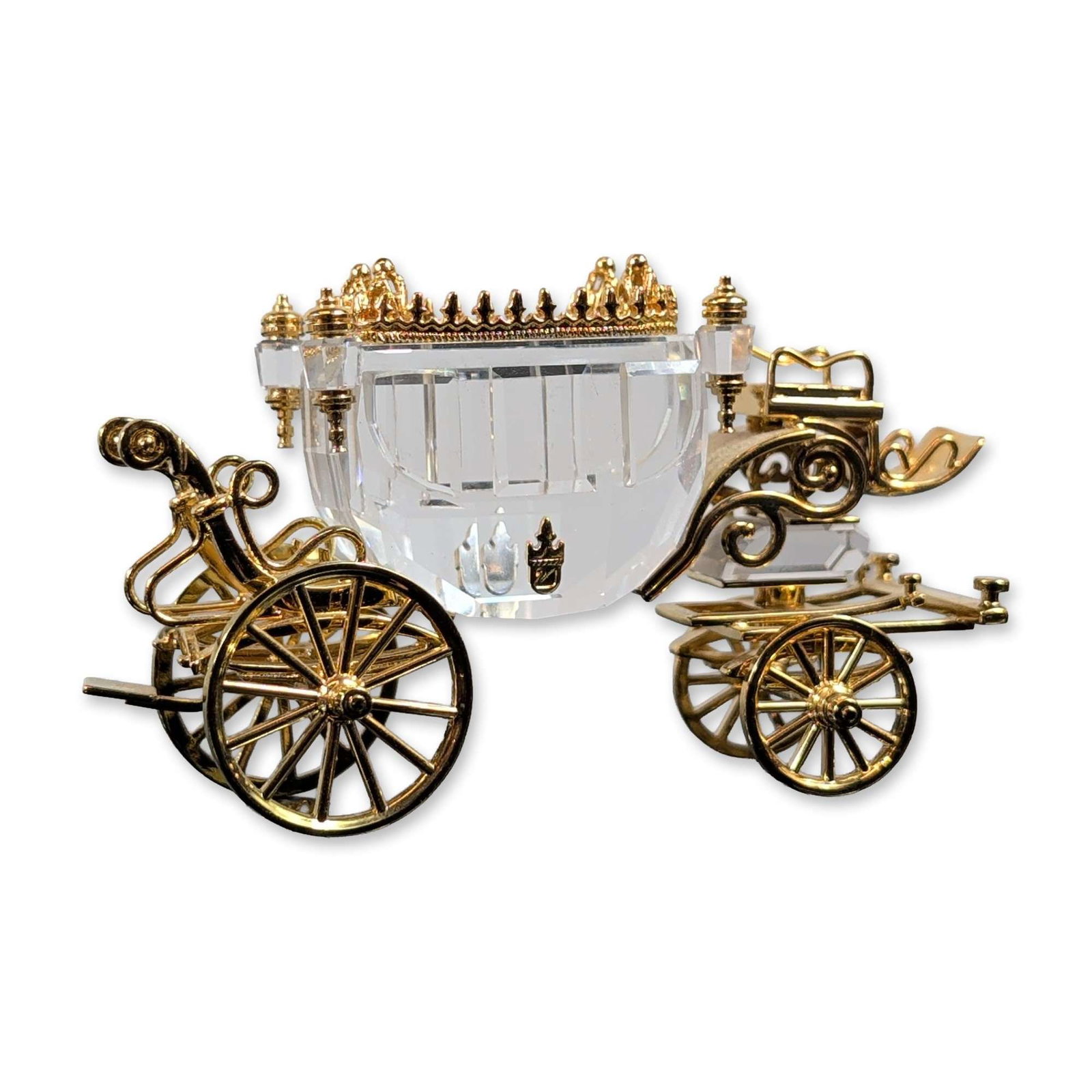 Swarovski Crystal Journeys Figurine, Carriage Gold: Miniature decorative carriage featuring a faceted clear crystal cabin accented with gold plated hardware. The design includes an ornate crown surmount, four corner finials, and a detailed chassis with