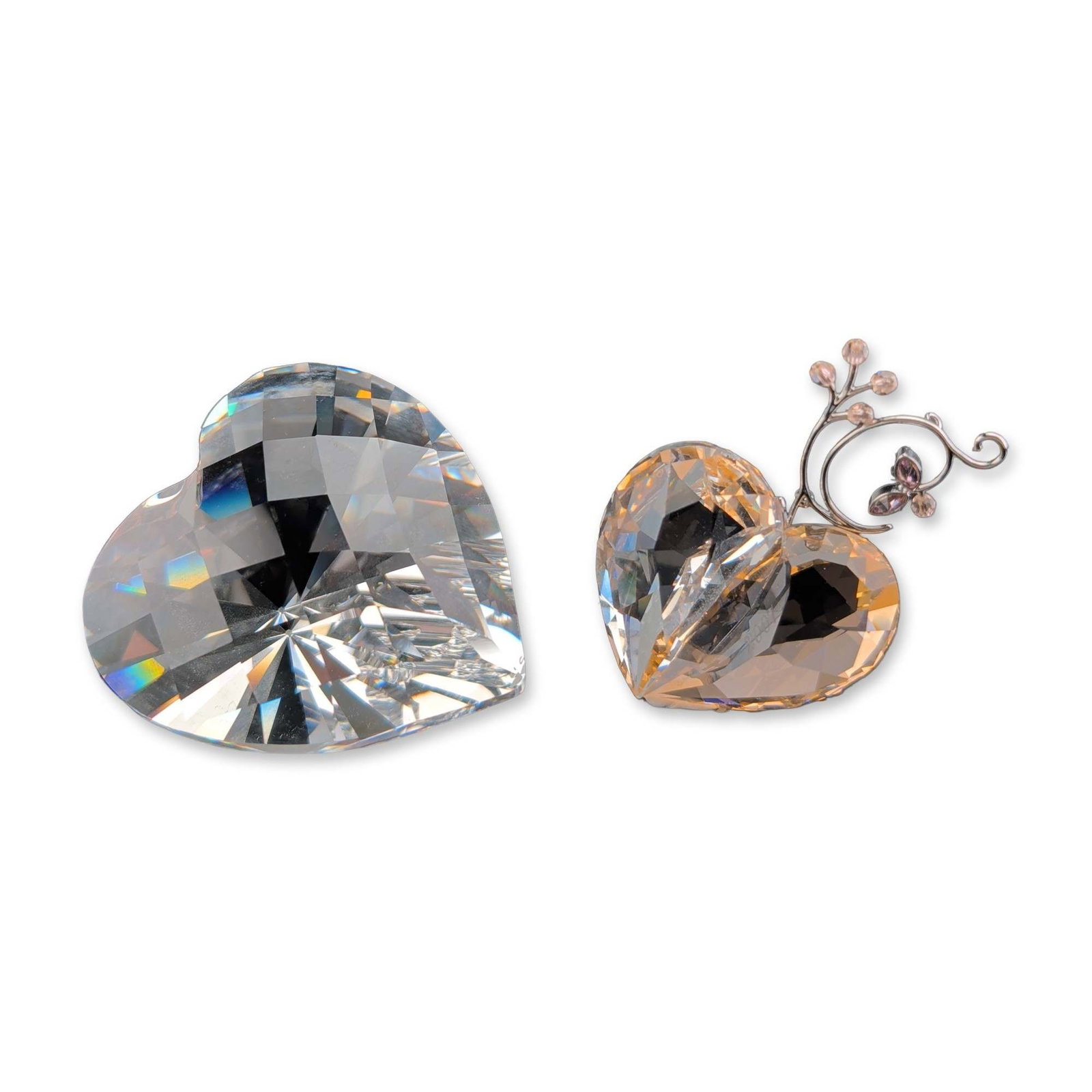 2pc Swarovski Crystal 2007 Heart Ornament and Figurine: Swarovski. Heart ornament in faceted lead crystal, featuring clear and peach-toned hues with a silver-tone metal topper with peach and purple crystal accents. Accompanied by a clear heart-shaped cryst