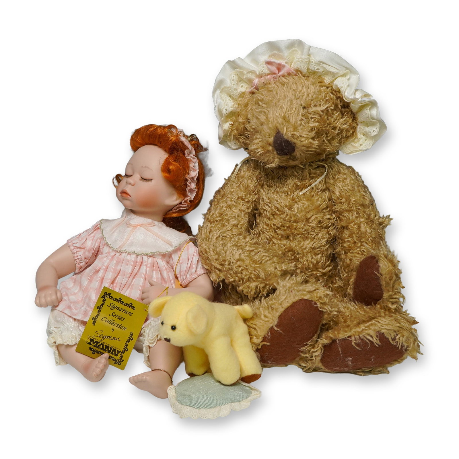 Seymour Mann Signature Series Porcelain Doll with Plush Bear & Dog: From the Signature Series Collection by Seymour Mann, this limited edition porcelain doll is marked 88 of 1200 on the neck and includes its original gold hang tag. The doll features sculpted closed ey