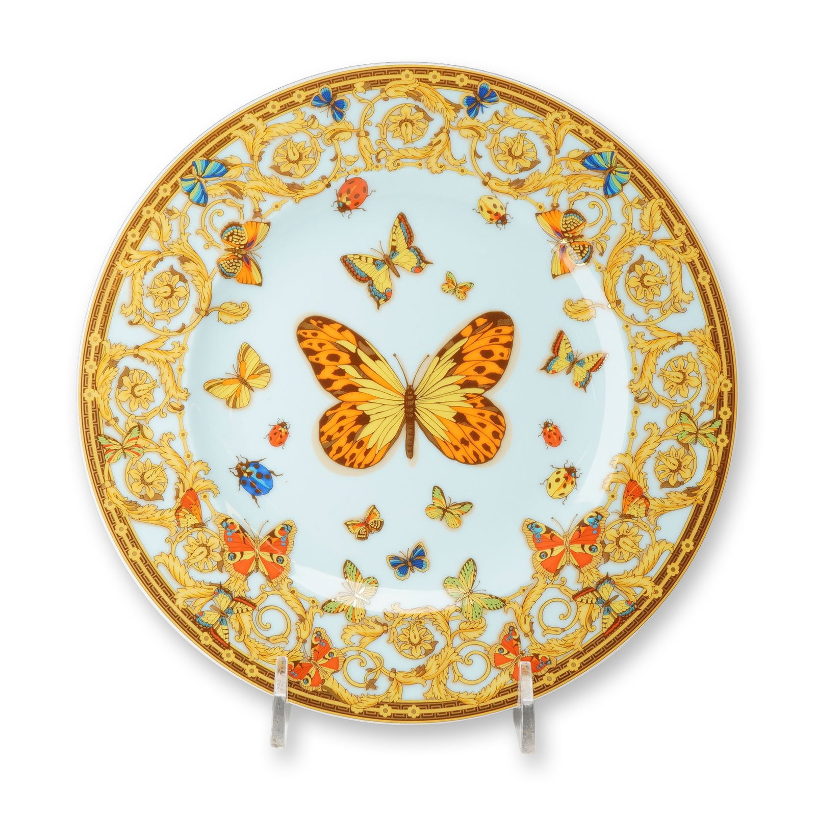 Rosenthal Versace Le Jardin de Versace Bread and Butter Plate: Rosenthal for Versace porcelain bread and butter plate in the Le Jardin de Versace pattern. The circular form features a pale blue central ground decorated with various species of butterflies and lady