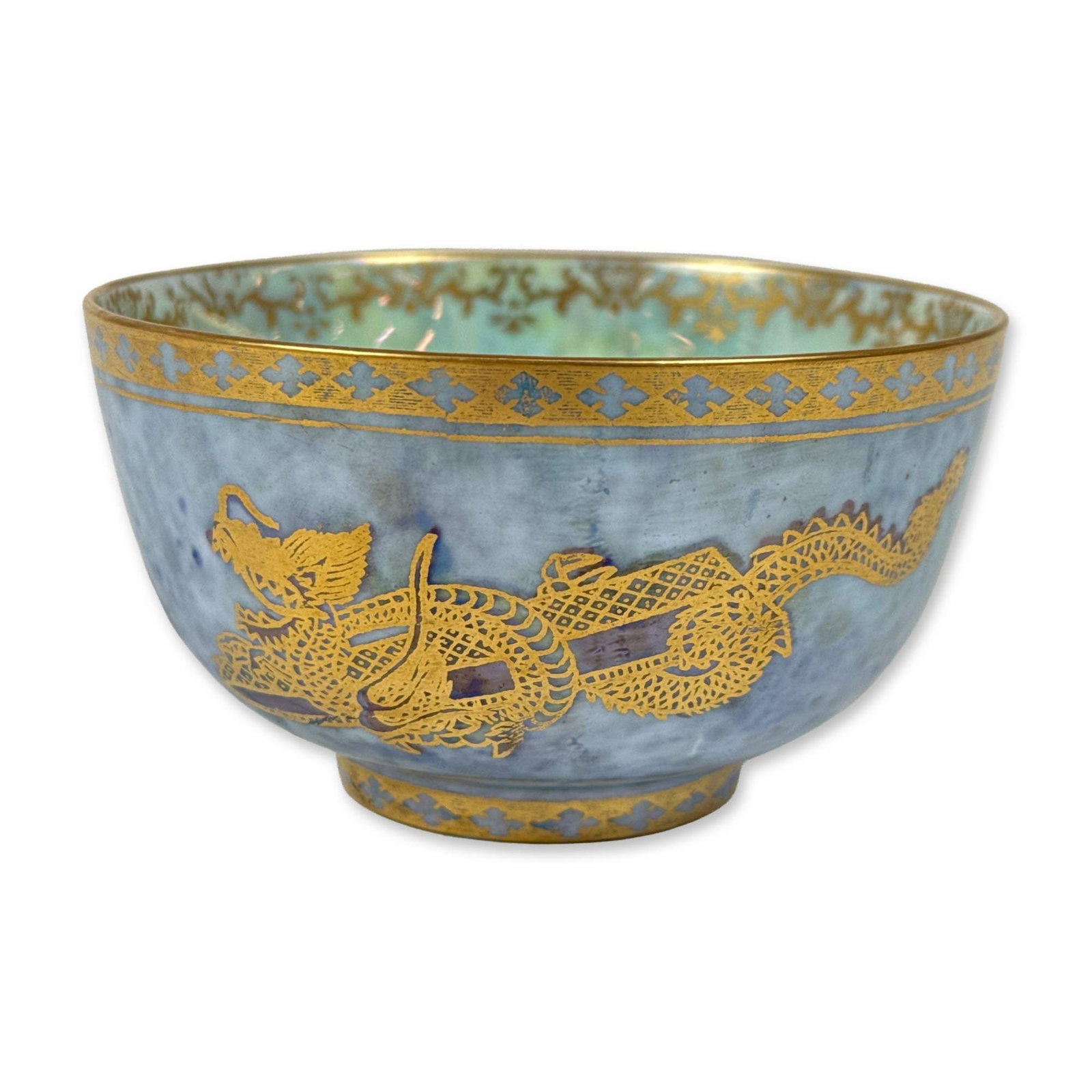 Wedgwood Dragon Luster Porcelain Bowl, Z4829: Designed by Daisy Makeig-Jones. The exterior is finished in a mottled powder blue luster ground decorated with a gilded dragon motif. The rim and foot are accented with repeating gilded quatrefoil bor