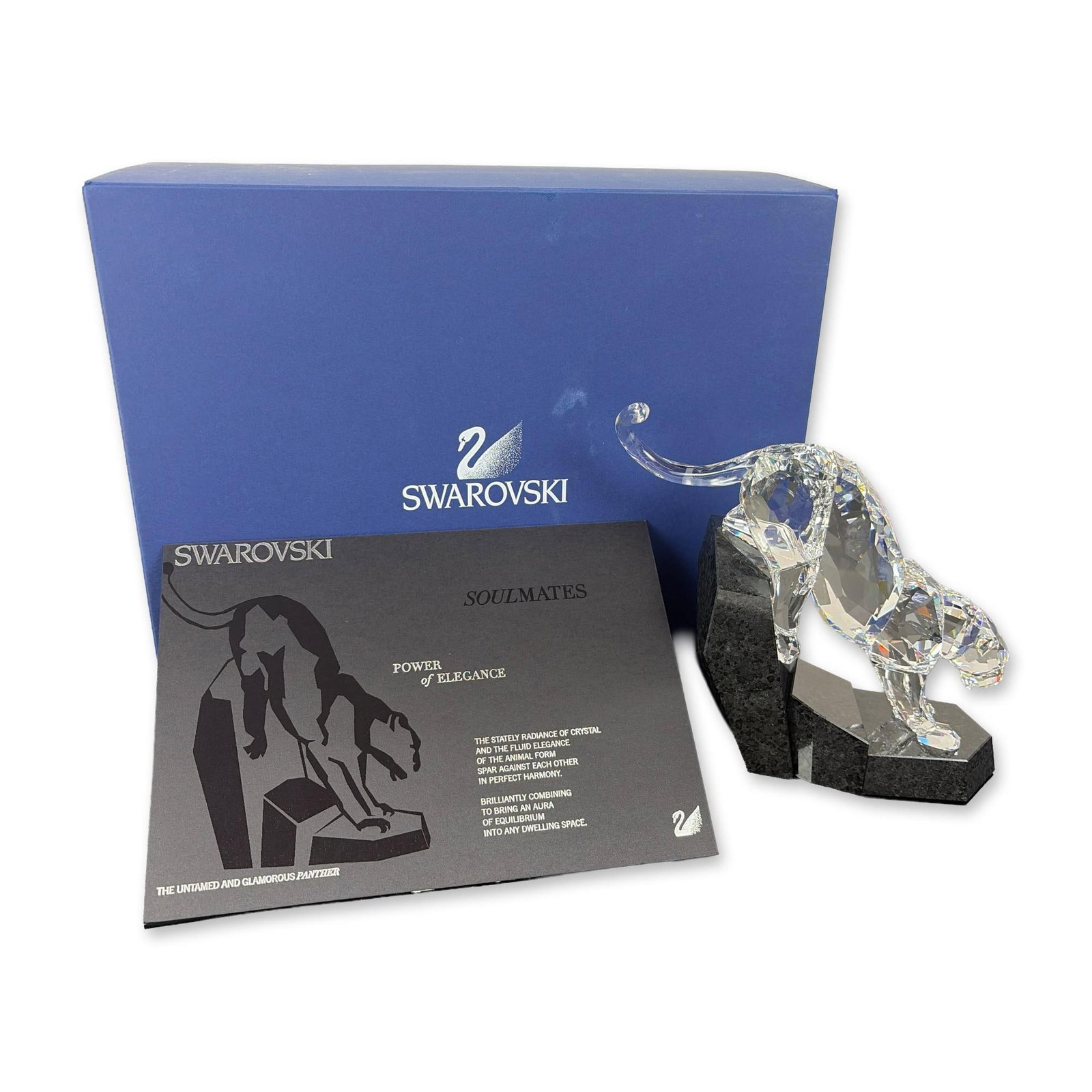 Swarovski Power of Elegance Soulmates Crystal Panther Figure: Swarovski Power of Elegance faceted clear lead crystal panther figure in a dynamic prowling pose mounted on a multi-faceted geometric black stone base. Includes the original blue manufacturer box and 