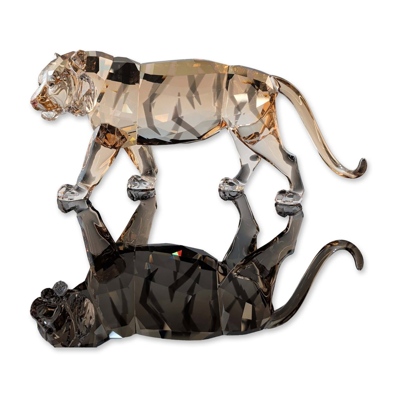 Swarovski SCS 2010 Golden Shine Crystal Tiger Figurine: Swarovski. Faceted crystal figurine from the Endangered Wildlife series, depicting a tiger in a crouching prowl. The piece is executed in amber-toned faceted lead crystal. The underside of a hind paw 