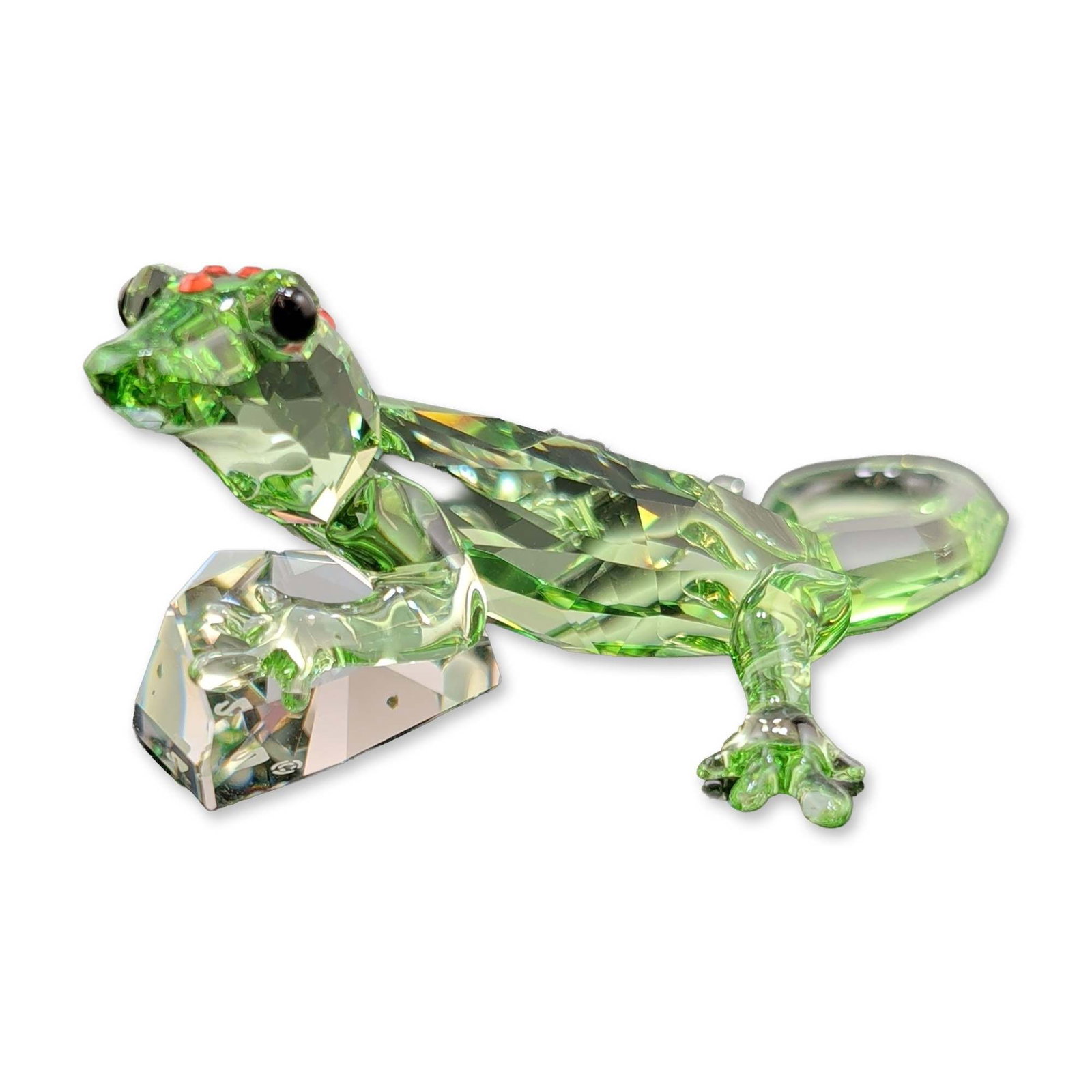Swarovski 2008 SCS Event Crystal Figurine, Gecko: Swarovski 2008 SCS Event Piece gecko figurine in bright green faceted lead crystal with orange accents and dark eyes, mounted to a clear faceted crystal base. Etched swan mark to the base. Accompanied