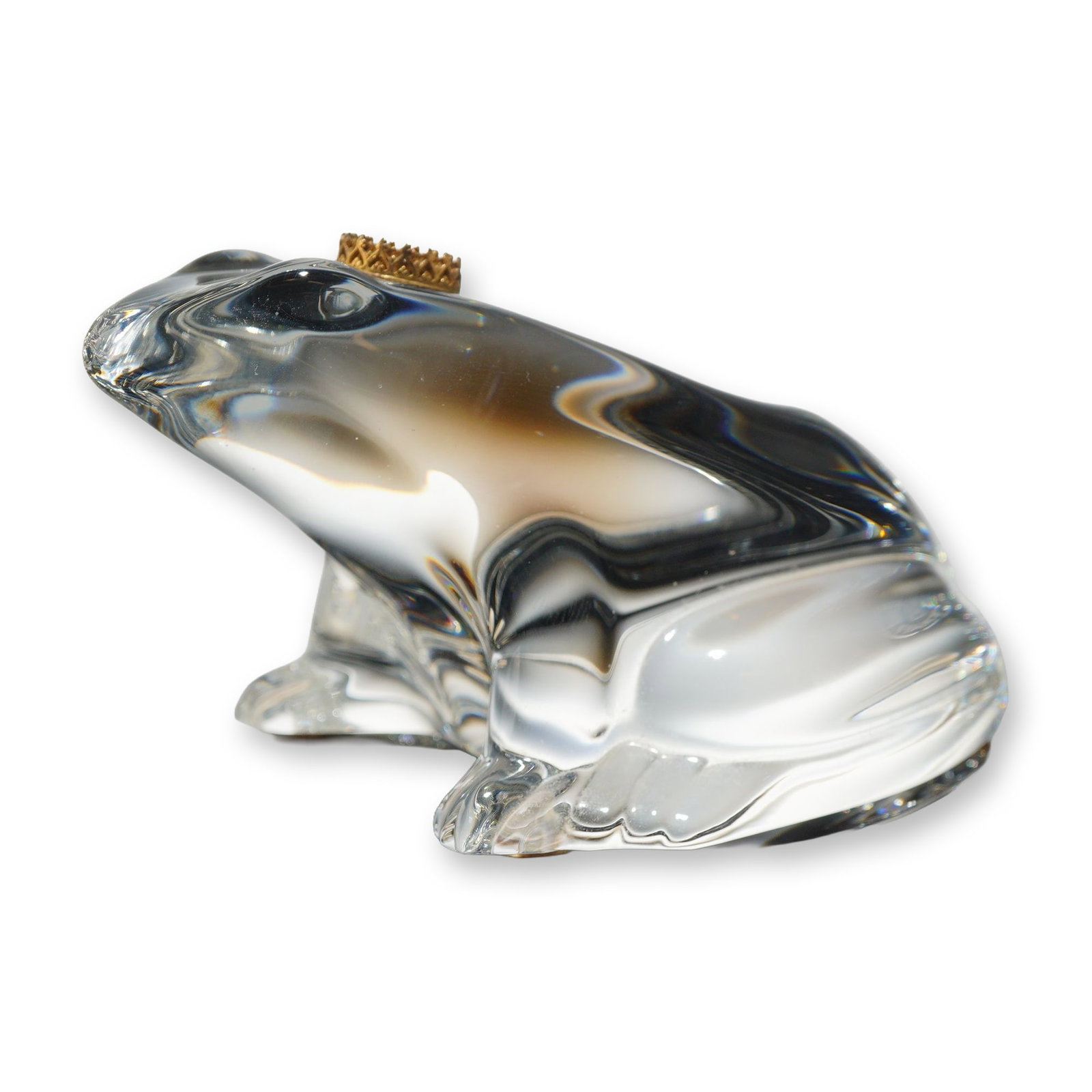 Baccarat Crystal Frog Prince Figurine with Gold Crown: This figurine, produced by Baccarat, depicts the Frog Prince from the classic fairytale. The piece is crafted from clear lead crystal in a stylized, seated pose characterized by smooth, fluid lines an