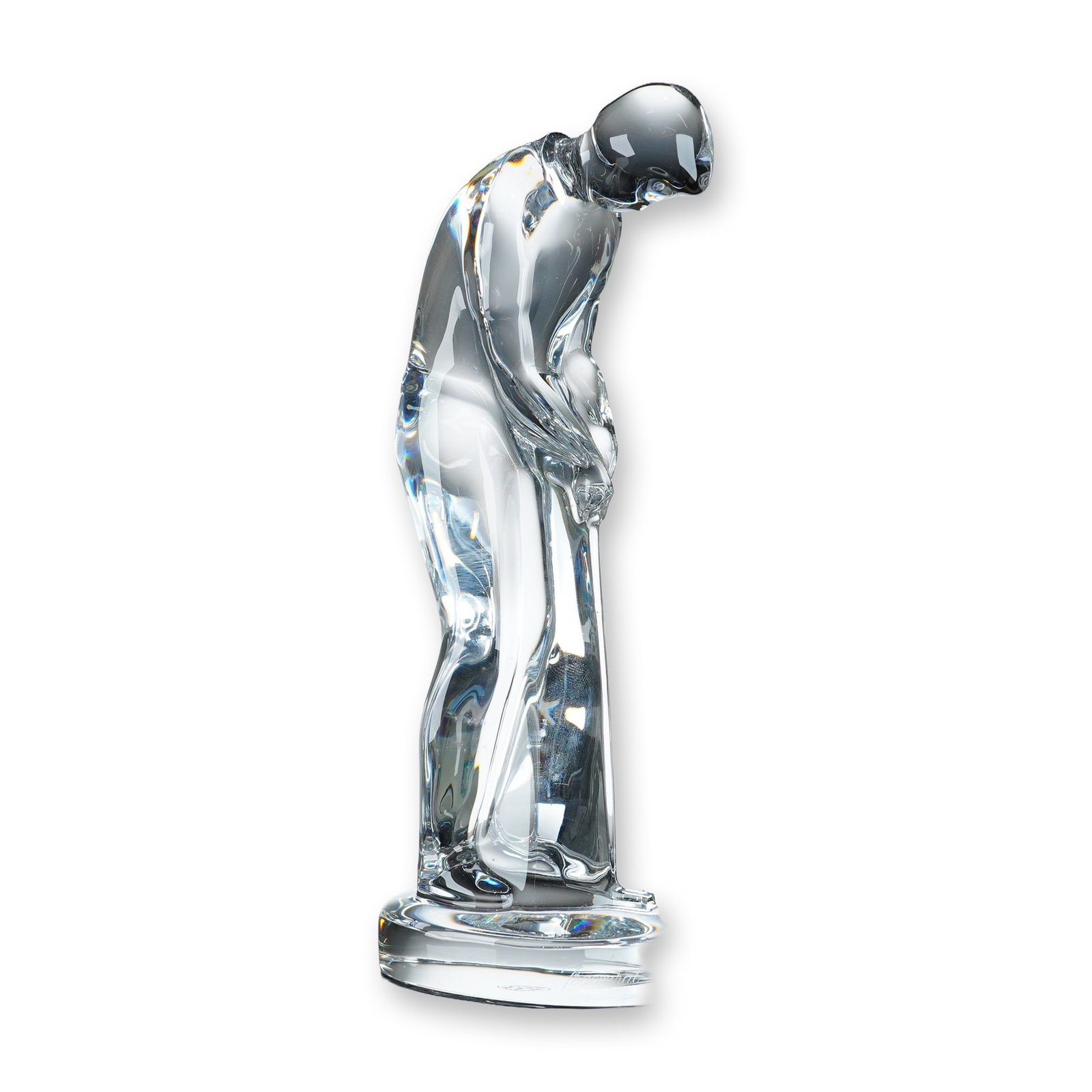 Baccarat Crystal Male Golfer Figurine: Baccarat. Clear lead crystal sculpture depicting a stylized male golfer in a putting stance, positioned on an integral oval base. The figurine features fluid, rounded contours and polished surfaces. B