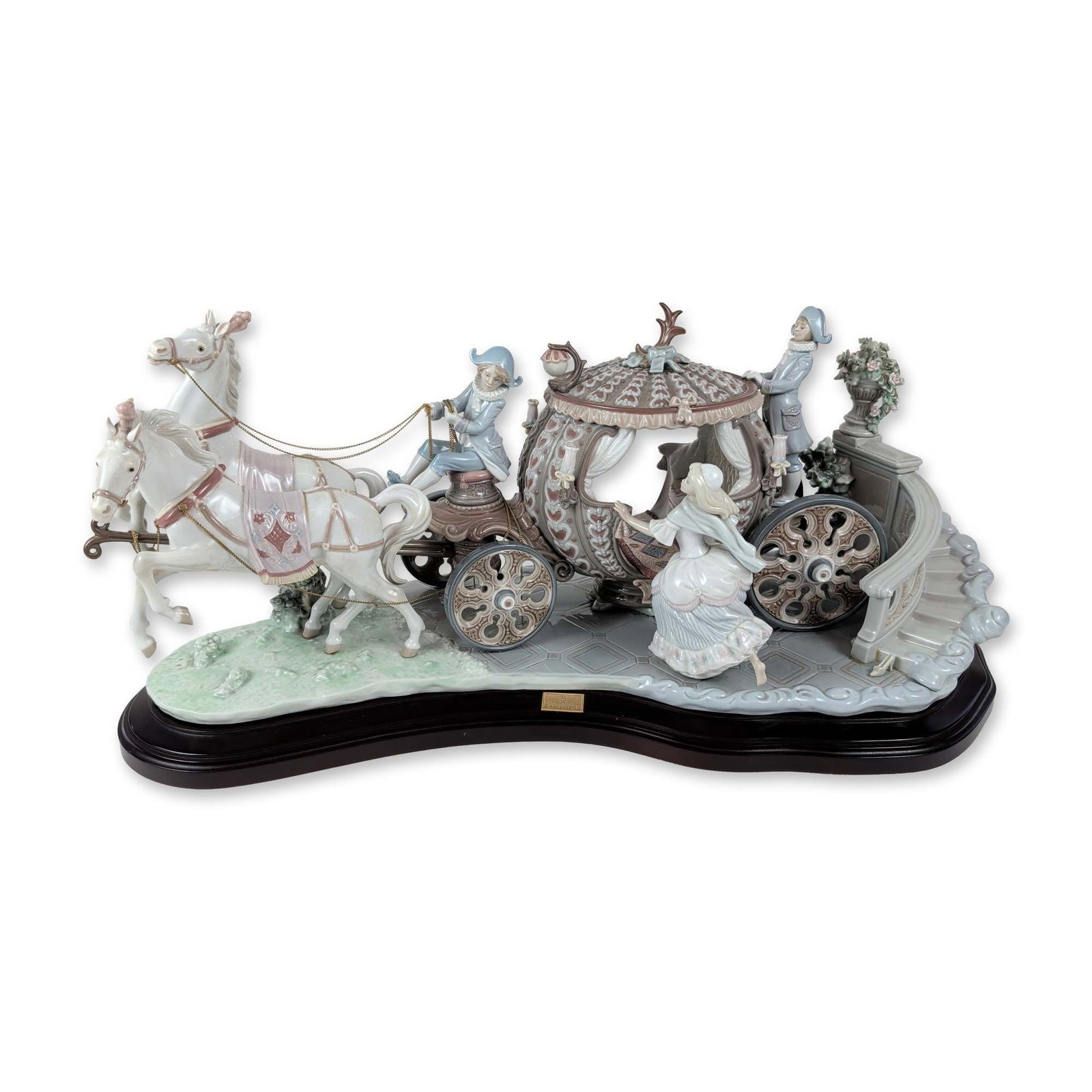 Lladro Sculpture, At Stroke Twelve 1001493 with Base: Lladro (Spanish, 20th century). This monumental limited edition polychrome glazed porcelain figurine group, model number 1493 and edition number 663, portrays Cinderella stepping out of an ornate Roco