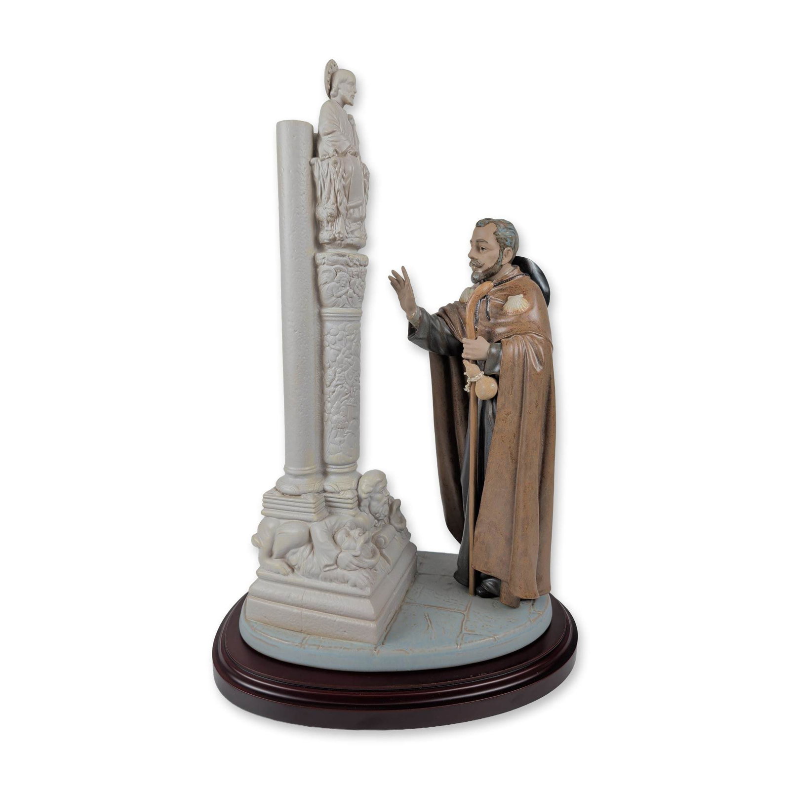 Lladro Matte Porcelain The Pilgrim at Santiago 1013581 with Base: The Pilgrim at Santiago (El Peregrino) is a stunning matte porcelain sculpture, portraying a traveler on the Way of Saint James. Clad in a brown cloak adorned with a scallop shell, the figure holds a 