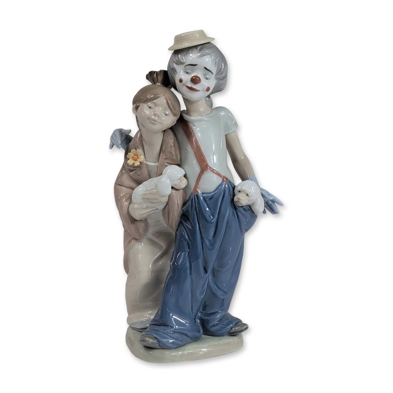 Lladro Society Pals Forever Porcelain Figurine 7686: Lladro Society glazed porcelain figurine, model number 7686, titled Pals Forever. The piece depicts a clown and a child standing together, both cradling white puppies. The clown is dressed in oversize
