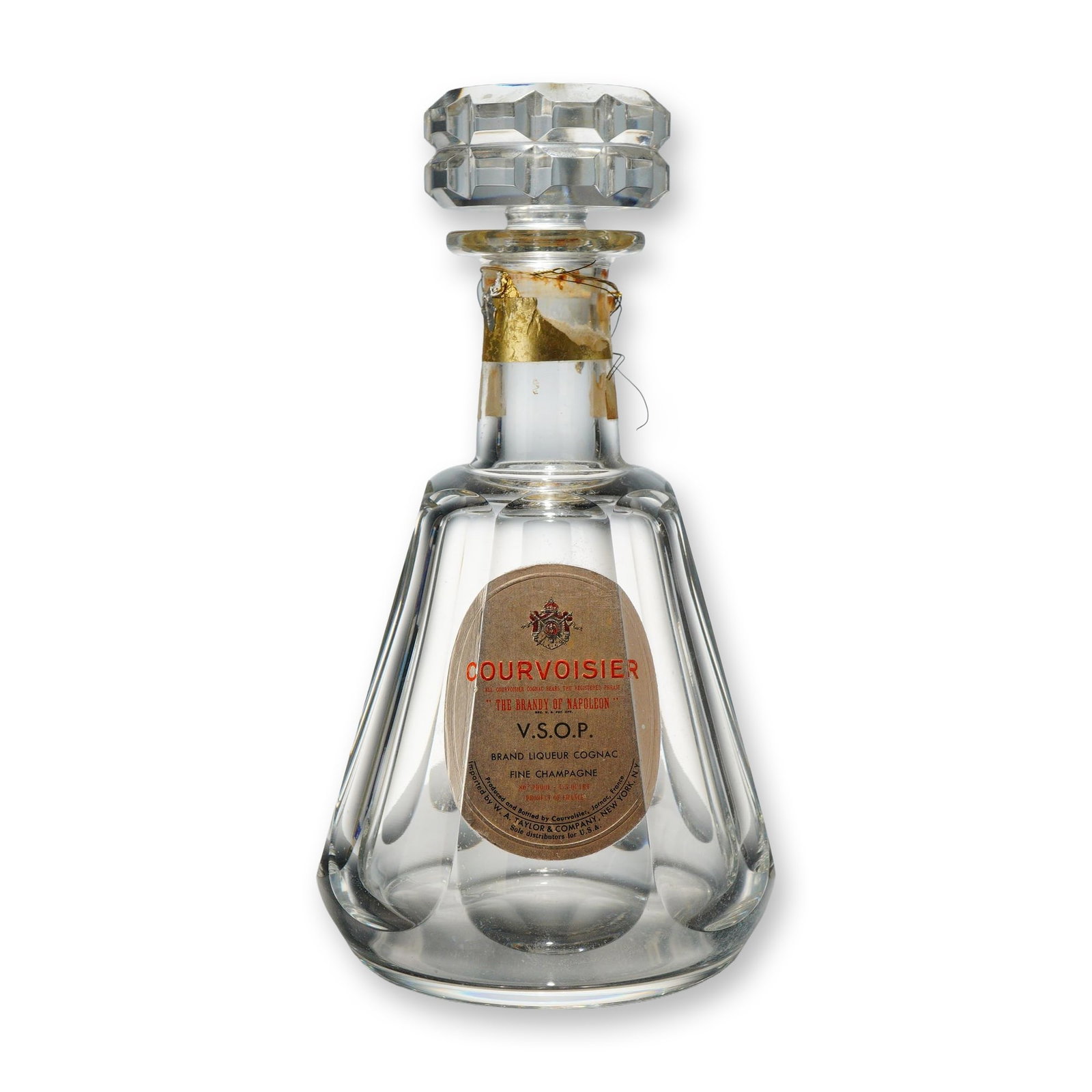 Baccarat Crystal Decanter with Stopper for Courvoisier The Brandy of Napoleon V.S.O.P. Cognac: A Baccarat crystal decanter and matching faceted stopper, originally produced for Courvoisier V.S.O.P. Cognac. The clear glass vessel features a tapered body decorated with wide vertical flutes. An ov