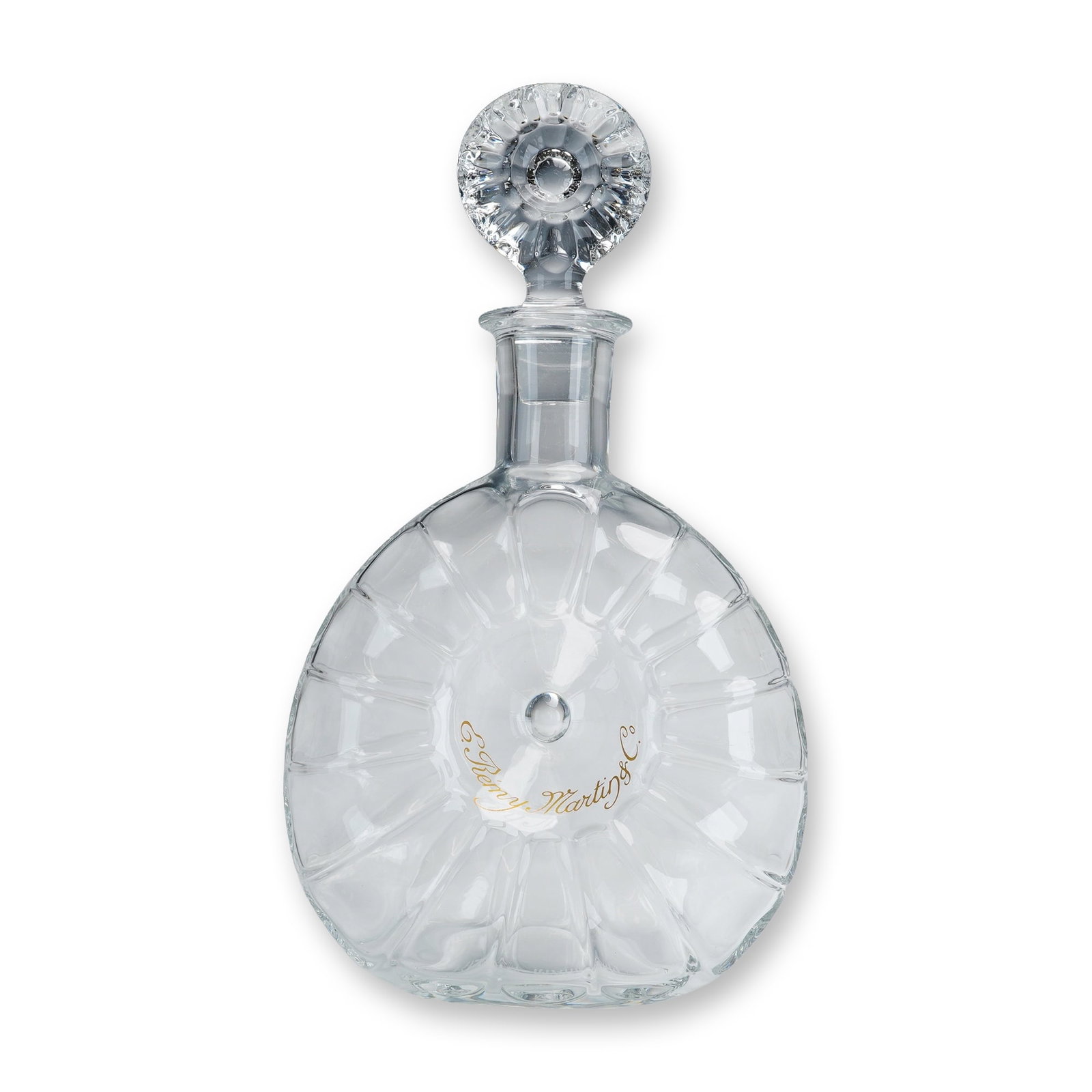 Baccarat Crystal Remy Martin Shell Decanter: Shell form decanter in clear lead crystal for E. Remy Martin and Co. Cognac, featuring a lenticular body with radiating optic ribs and a central dimpled point. Includes matching disk-form stopper with