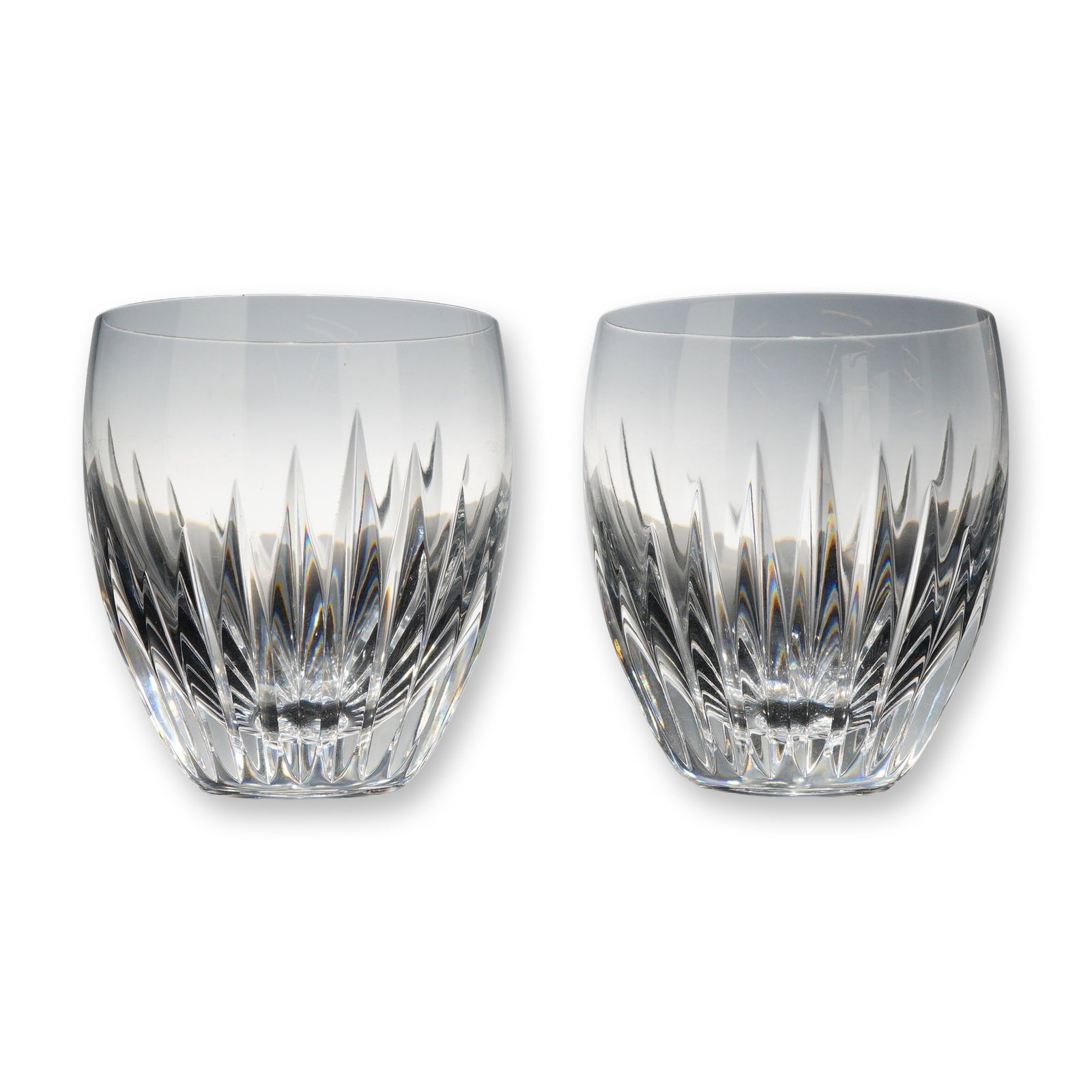 Pair of Baccarat Crystal Massena Tumblers: Baccarat, France. Pair of Massena pattern tumblers in clear lead crystal. Each glass features a rounded profile decorated with deep vertical wedge cuts radiating from the base and tapering to sharp