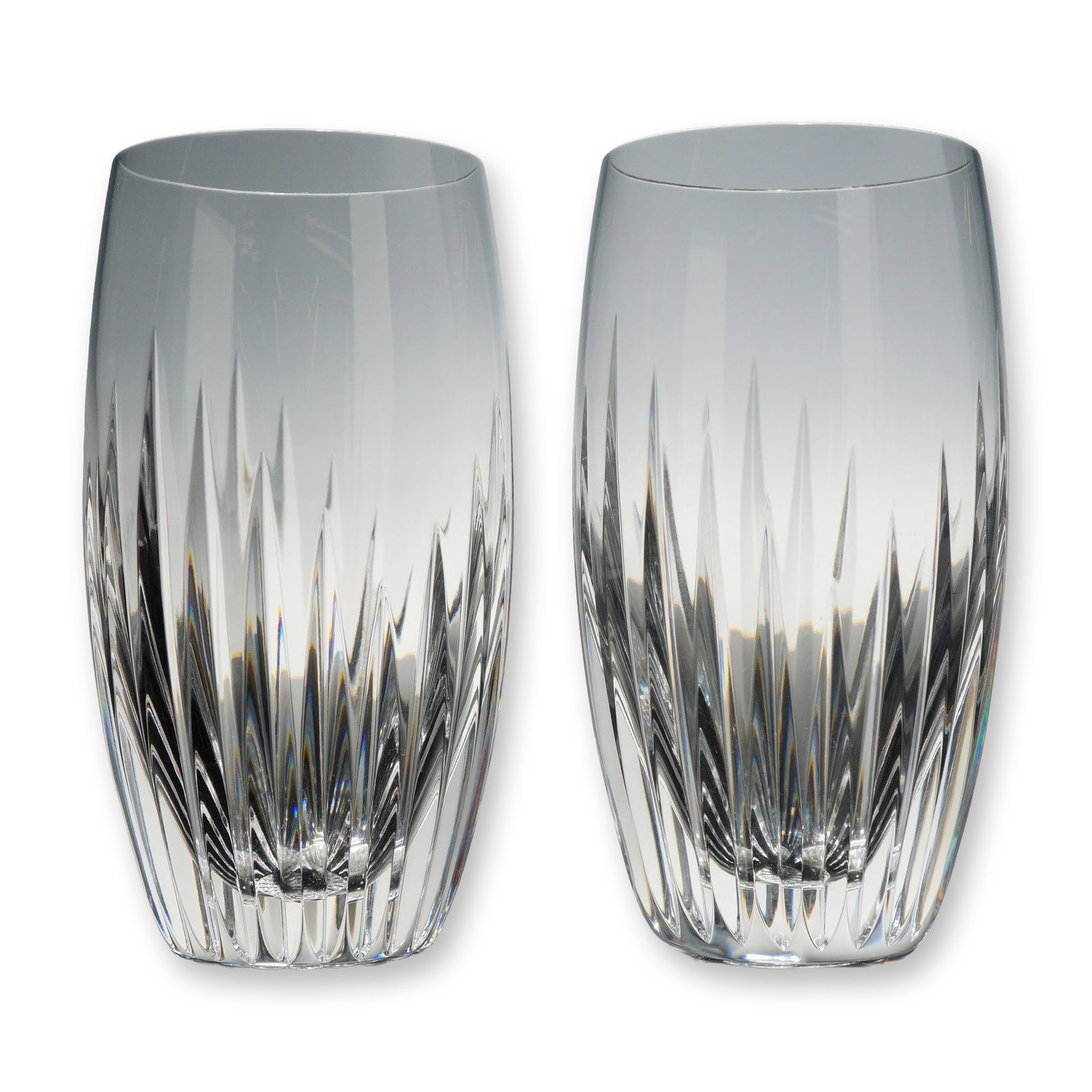 Pair of Baccarat Massena Crystal Highball Glasses: Pair of crystal highball glasses in the Massena pattern. These barrel-shaped tumblers are crafted from clear lead crystal, featuring deep, polished vertical wedge cuts that radiate from the base and
