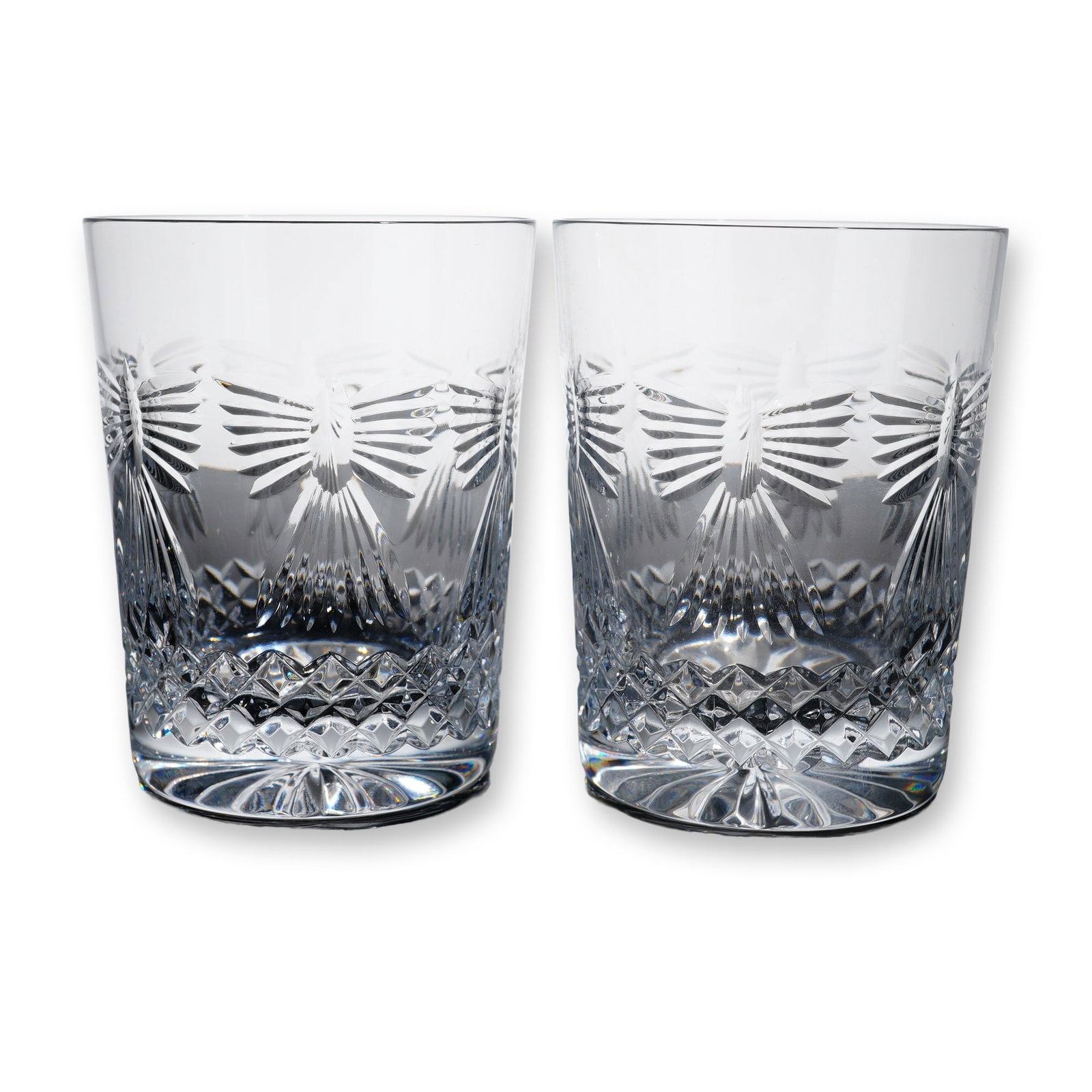 Pair of Waterford Millennium Happiness Double Old Fashioned Glasses: A pair of Waterford cut lead crystal double old-fashioned tumblers in the Happiness pattern from the Millennium Series. Each tumbler features a detailed cut geometric design, with a lower band of