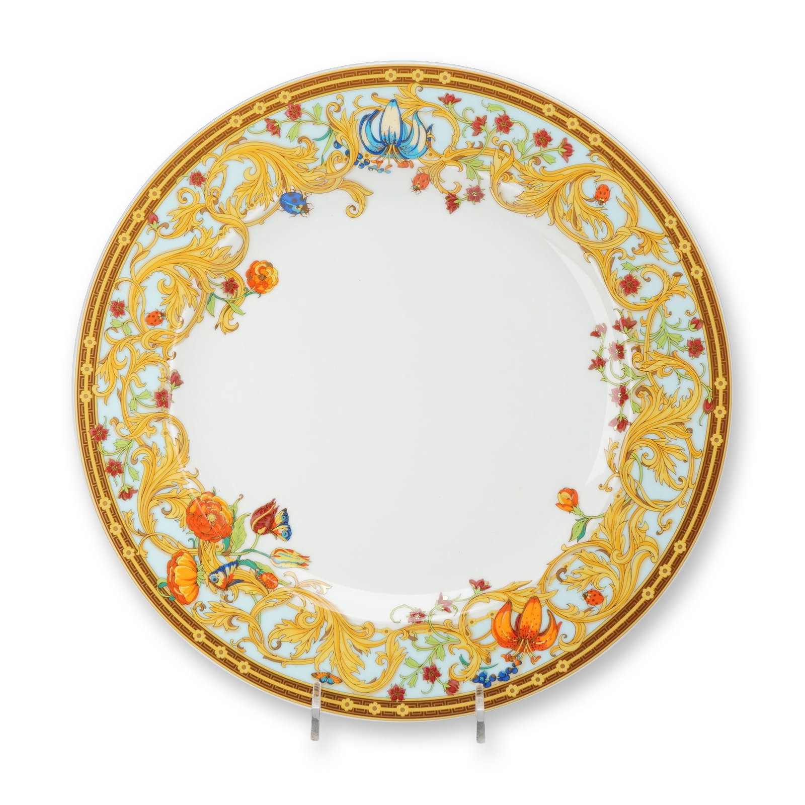 Rosenthal Versace Le Jardin de Versace Porcelain Dinner Plate: Versace for Rosenthal porcelain dinner plate in the Le Jardin de Versace pattern. The circular form features an elaborate wide border on a pale blue ground, decorated with scrolling golden acanthus le