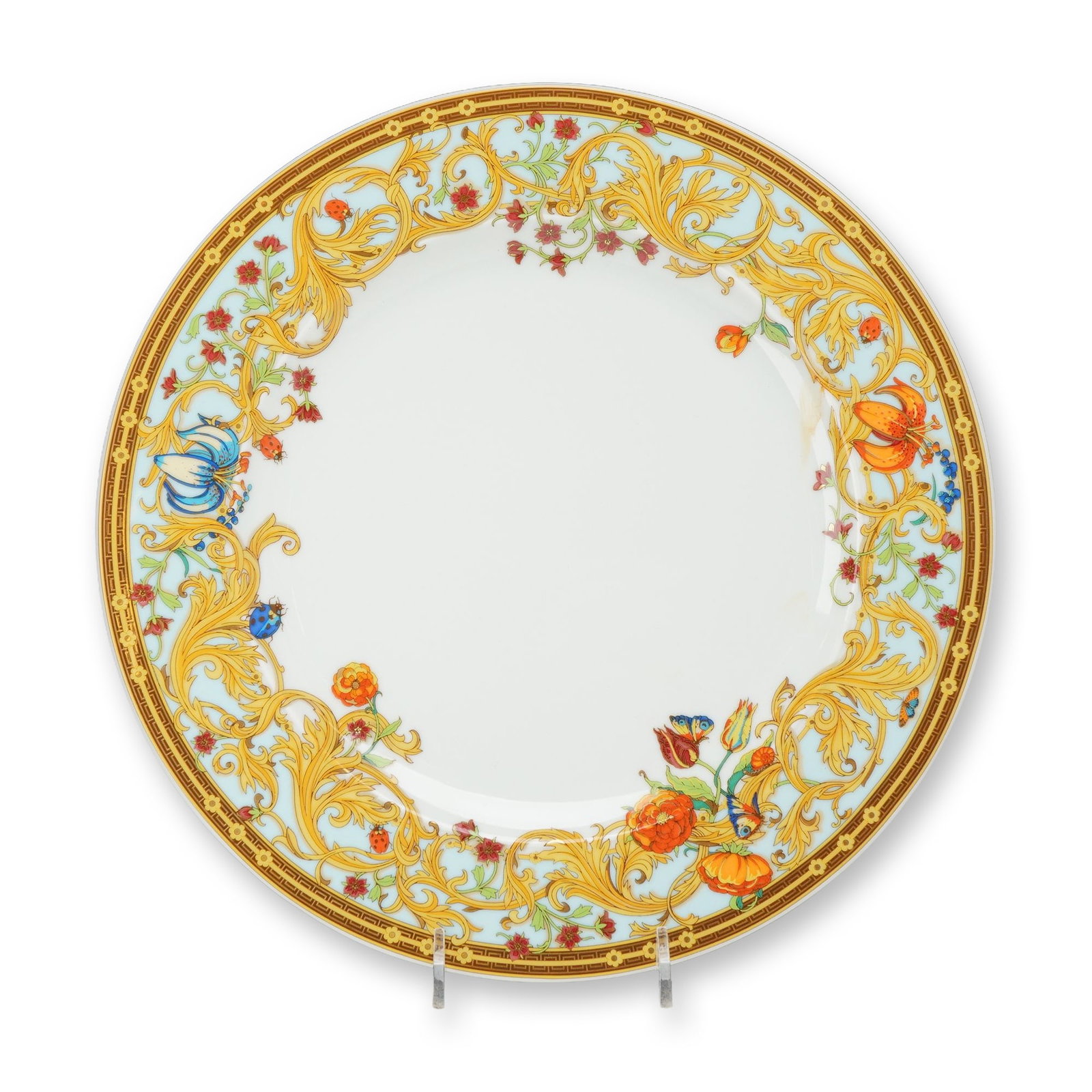 Rosenthal Versace Le Jardin de Versace Porcelain Plate: Rosenthal for Versace porcelain plate in the Le Jardin de Versace pattern. The circular form features transfer-decorated polychrome enamels and gilding, with a wide border of yellow acanthus leaf scro