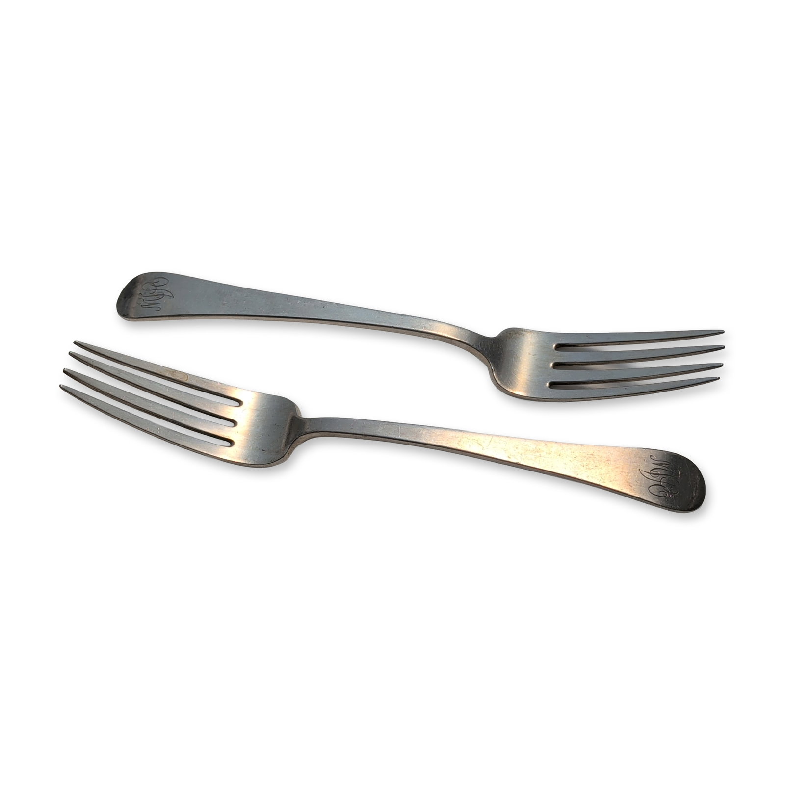 2pc Tuttle Silver Company Sterling Silver Dinner Forks, Hannah Hull: A pair of dinner forks crafted in solid sterling silver, designed in a classic pattern with smooth, plain handles. Each handle is engraved on the front with an interlaced script monogram. The reverse 