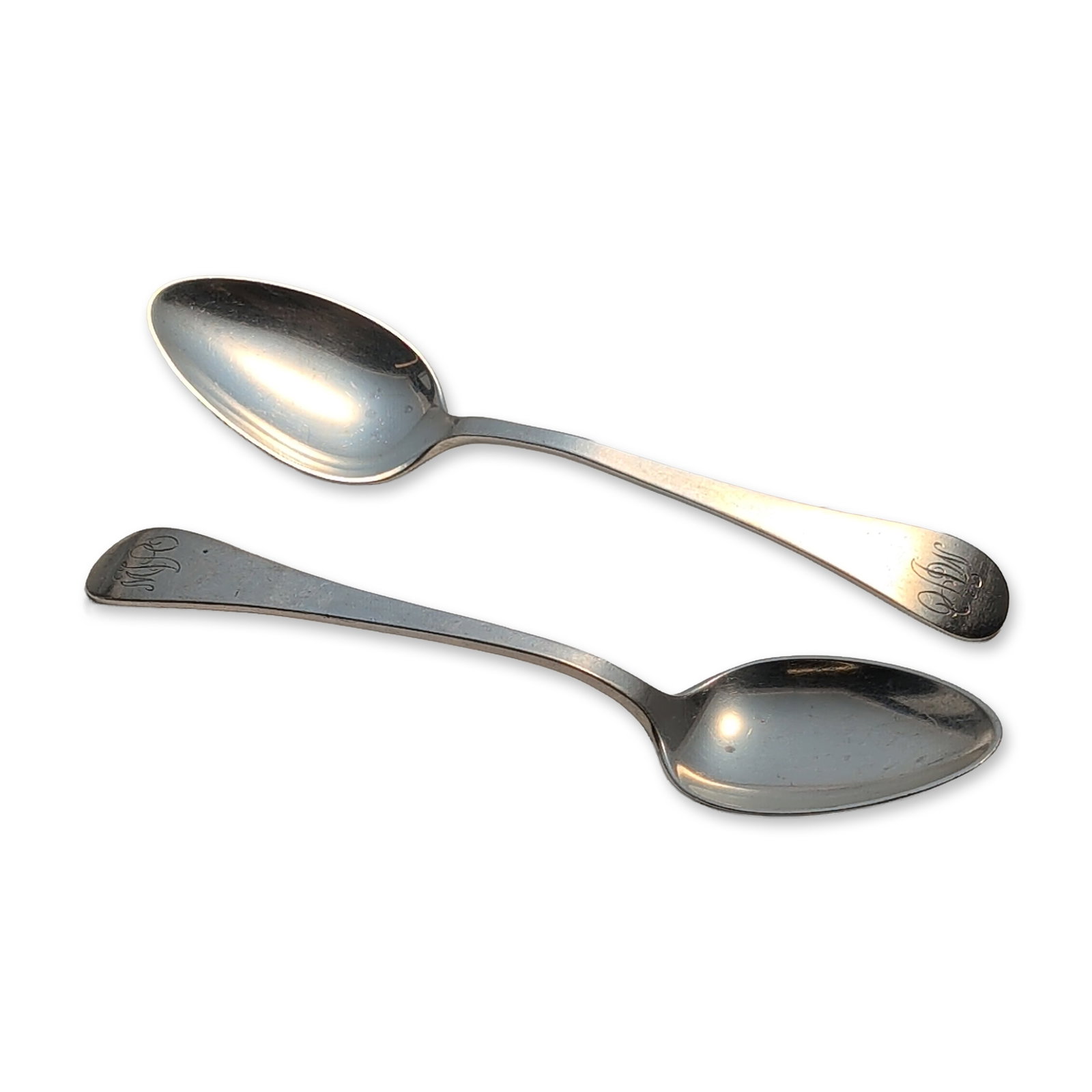 2pc Tuttle Silver Company Sterling Silver Teaspoons, Hannah Hull: Pair of sterling silver teaspoons having plain handles accented by engraved stylized monograms at the terminals. The reverse of each handle is stamped STERLING with the Tuttle Silver Company hallmarks