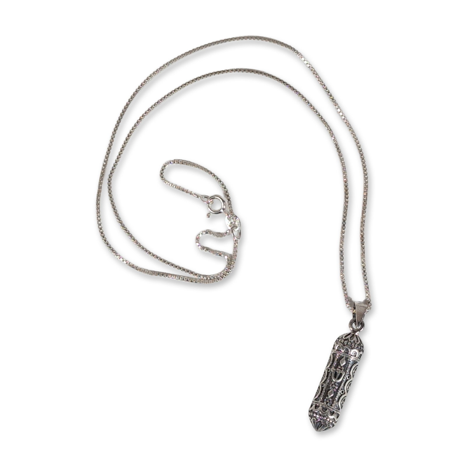Sterling Silver Ornate Mezuzah Pendant Necklace: Sterling silver necklace featuring a cylindrical mezuzah pendant and a fine box chain. The pendant displays ornate scrollwork and beaded detailing with a raised Hebrew letter Shin at the center. The p