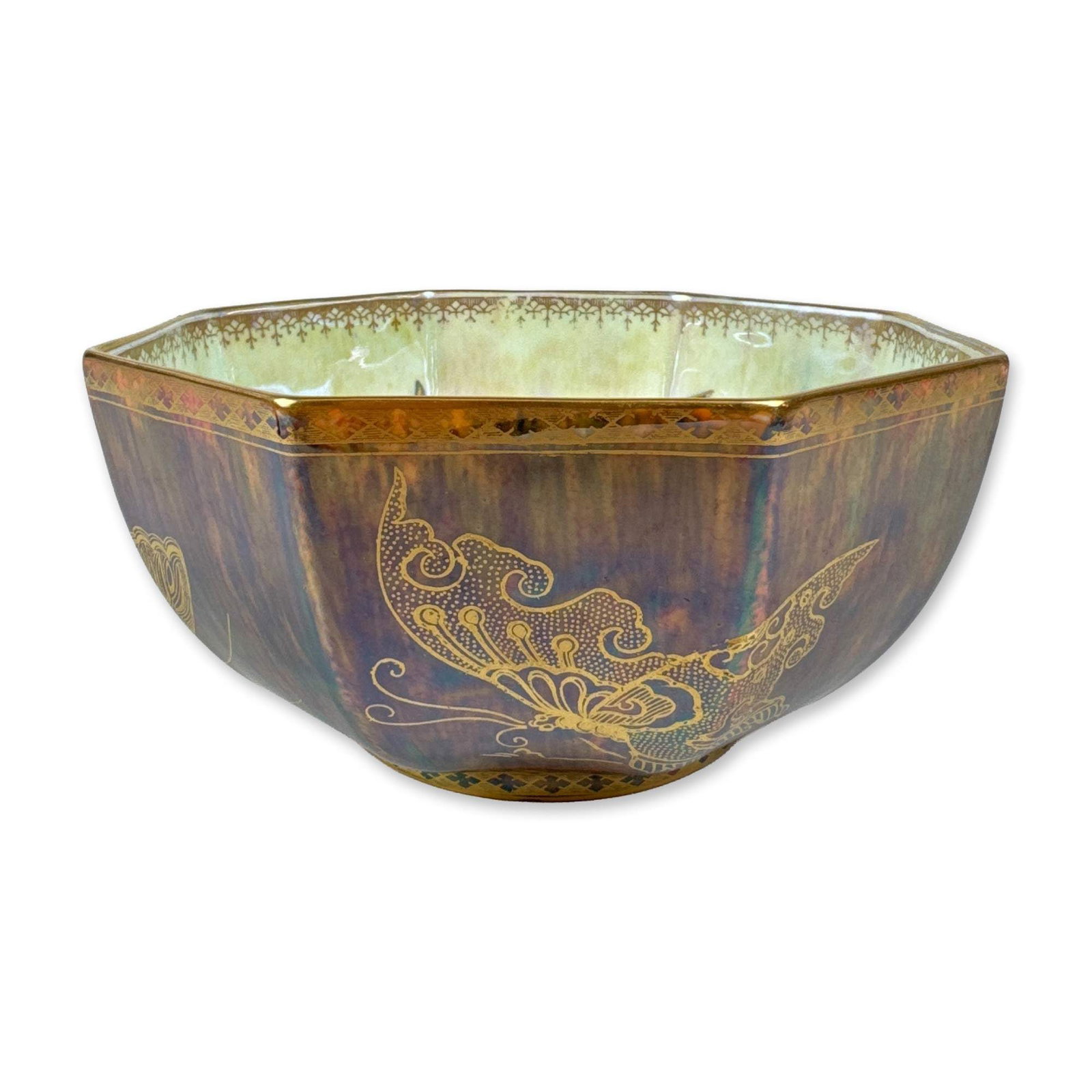 Wedgwood Luster Butterfly Octagonal Bowl, Z4830: Octagonal bowl in bone china featuring iridescent luster glazes. The exterior is finished in a mottled purple and bronze-toned mother-of-pearl luster ground with large, gilded butterfly motifs and a g