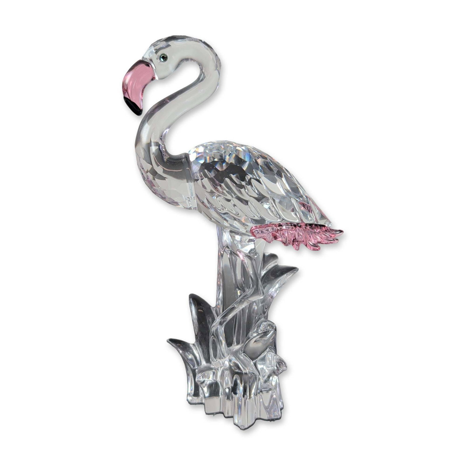 Swarovski Crystal Figurine Flamingo with Pink Feathers: Swarovski faceted lead crystal flamingo figurine featuring a clear body and neck accented with pink crystal on the beak tip and tail feathers. The piece is set upon a stylized clear crystal splashing 