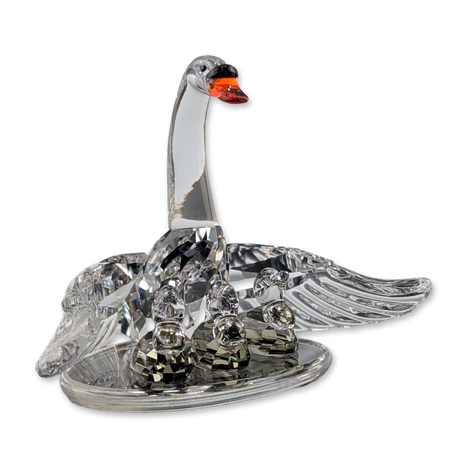 Swarovski Crystal Swan Family Figurine: Swarovski Silver Crystal faceted lead crystal figurine titled Swan Family from the Beauties of the Lake collection. The piece features a mother swan with three cygnets nestled within her wings, detail