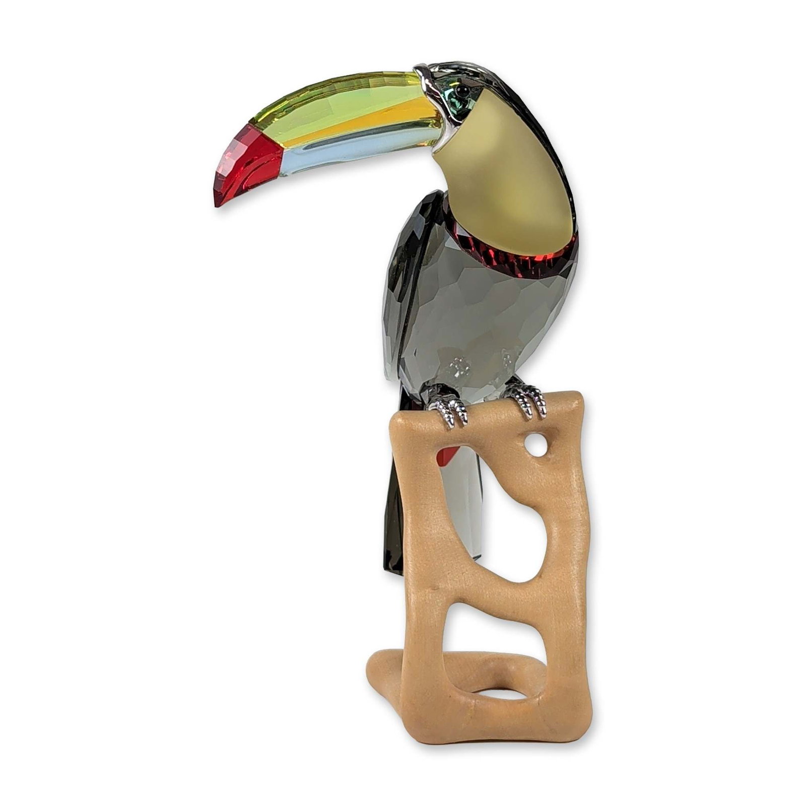 Swarovski Paradise Bird Toucan Crystal Figurine: Swarovski Paradise Bird collection. Toucan figurine, model 850600, featuring a faceted smoky-gray crystal body with a frosted pale-yellow breast. The prominent beak is composed of multiple crystal ele