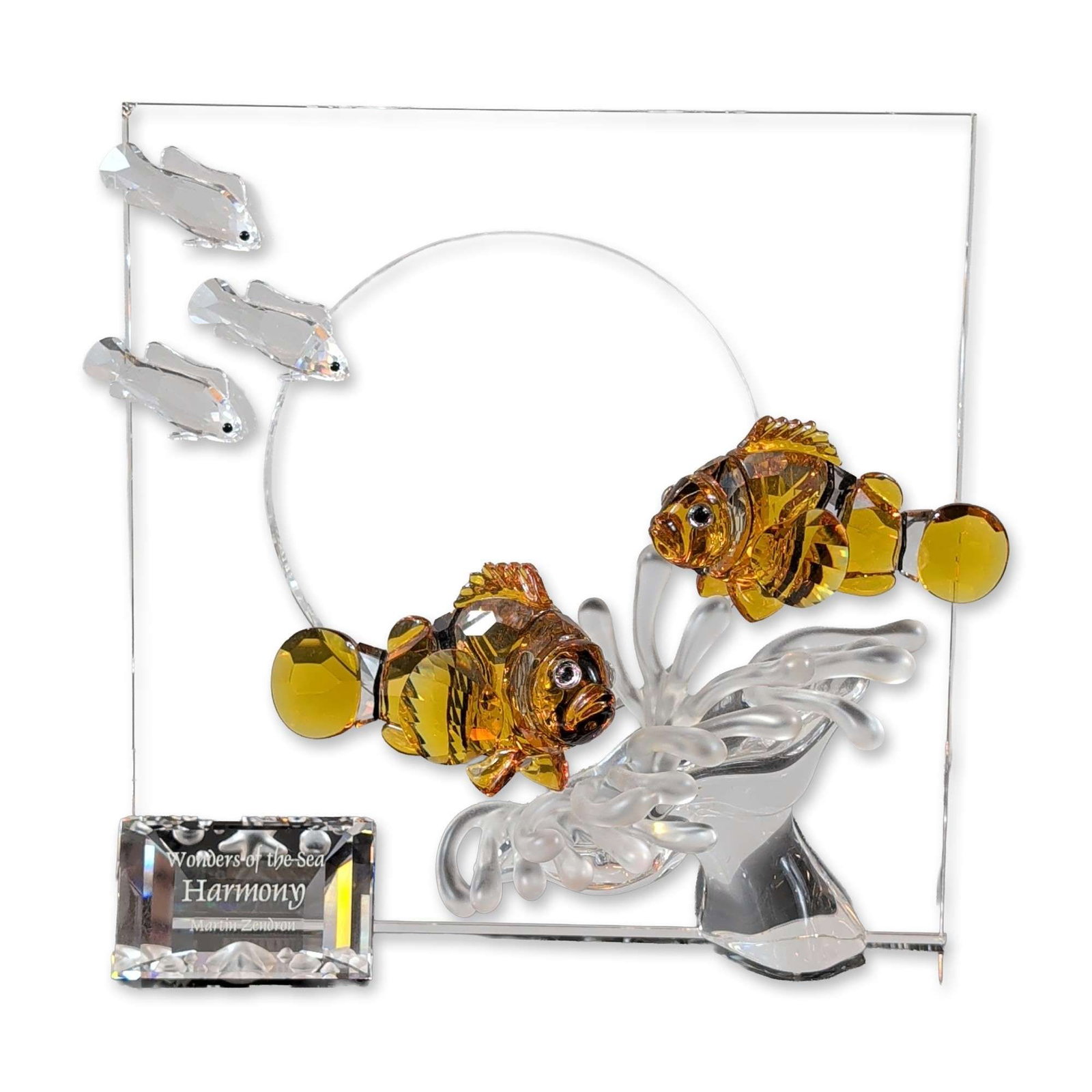 Swarovski 2005 SCS Wonders of the Sea Sculpture, Harmony Color with Title Plaque: Swarovski 2005 SCS annual edition. Figurine titled Harmony from the Wonders of the Sea trilogy, crafted in multi-faceted clear and amber lead crystal. The design features two amber-colored clownfish s