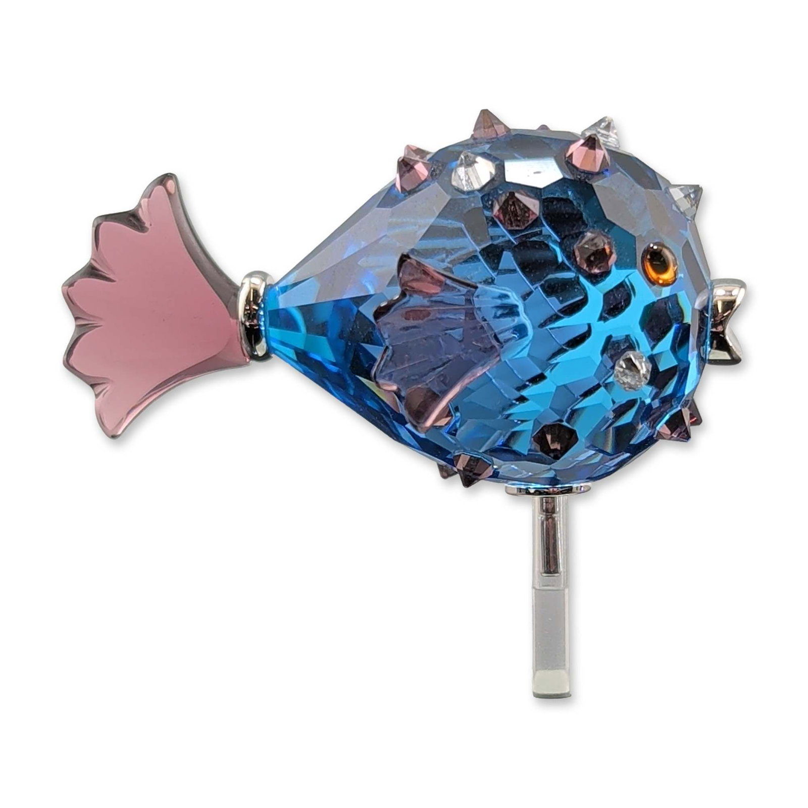 Swarovski Crystal Paradise Figurine, Cleona Capri Blue: Swarovski. Pufferfish figurine from the Paradise collection, titled Cleona, in Capri Blue. Crafted in faceted and smooth lead glass crystal, featuring Capri Blue bodies with lavender-toned spikes, tai