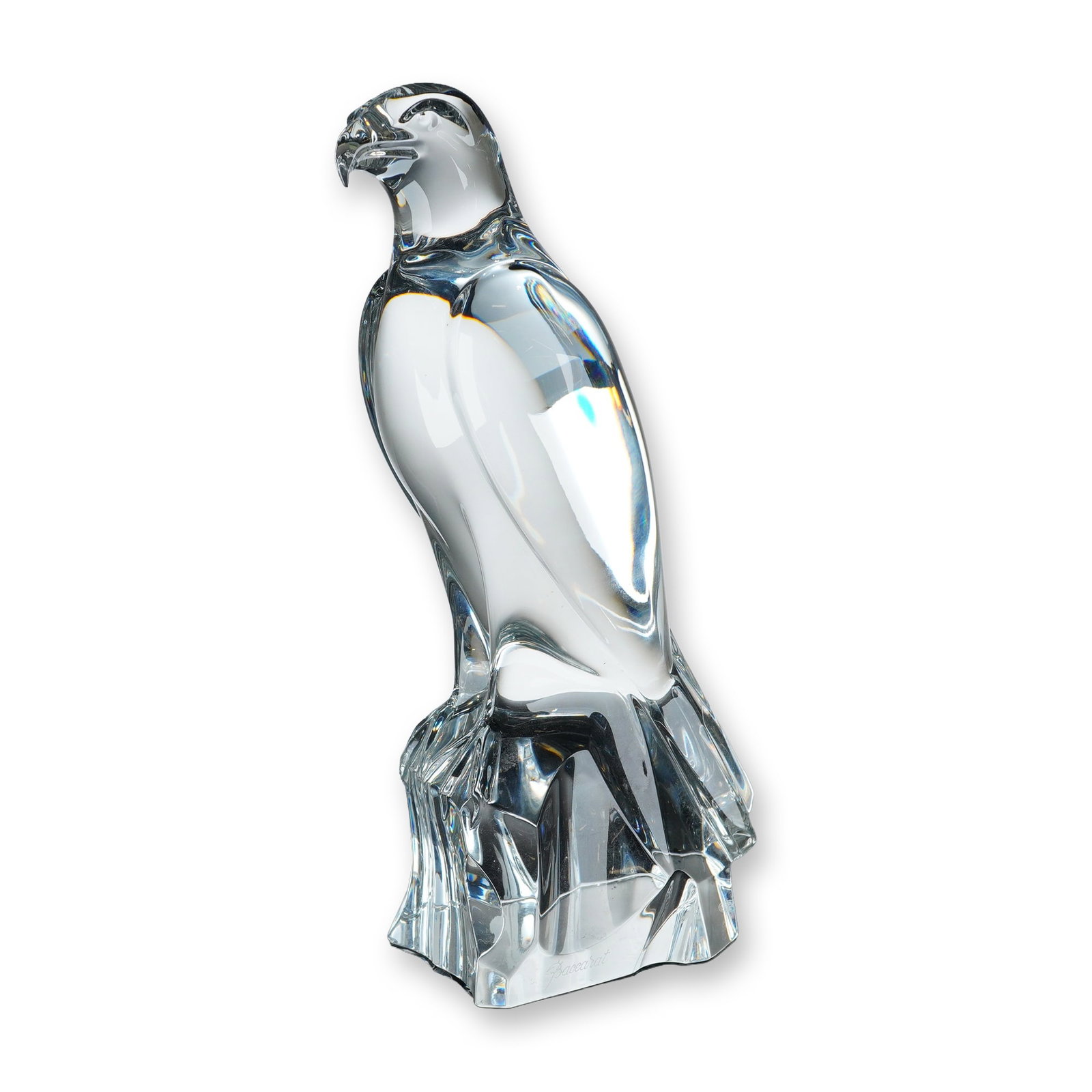 Baccarat Crystal Large Falcon Sculpture: Baccarat, France. Large falcon sculpture in clear lead crystal. The figurine features a modernist stylized form with smooth, polished surfaces, depicting a bird of prey in a perched position. It stand