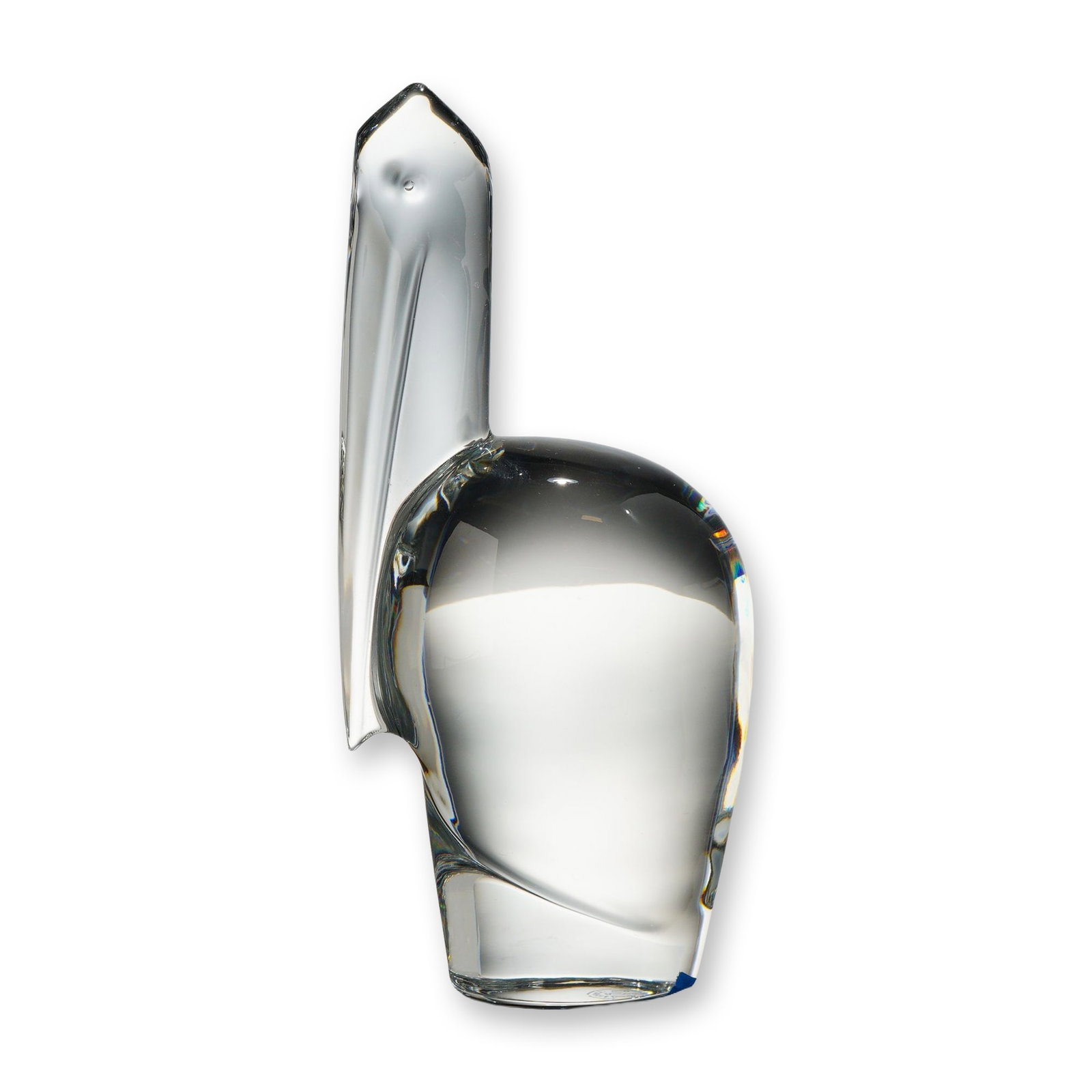 Baccarat Crystal Pelican Figurine: This Baccarat crystal figurine depicts a pelican in a minimalist, modernist style. Manufactured in France, the piece is crafted from solid, clear lead crystal characterized by high clarity and light r