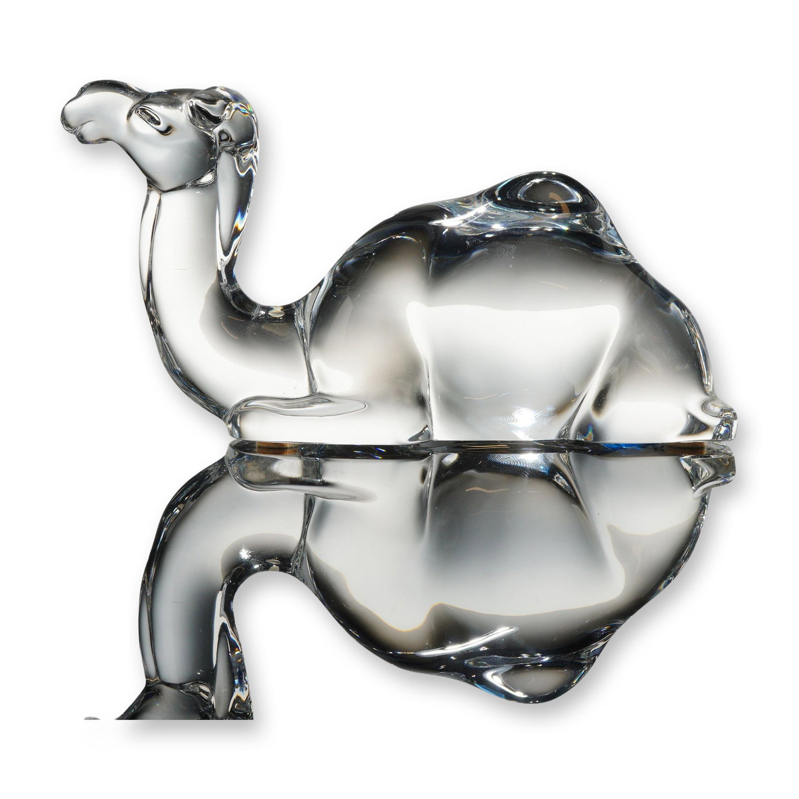 Baccarat Crystal Noah's Ark Dromedary Camel Figurine: A clear lead crystal figurine of a dromedary camel from the Baccarat Noah's Ark collection. This sculpture depicts a single-humped camel in a reclining position, characterized by a minimalist and styl