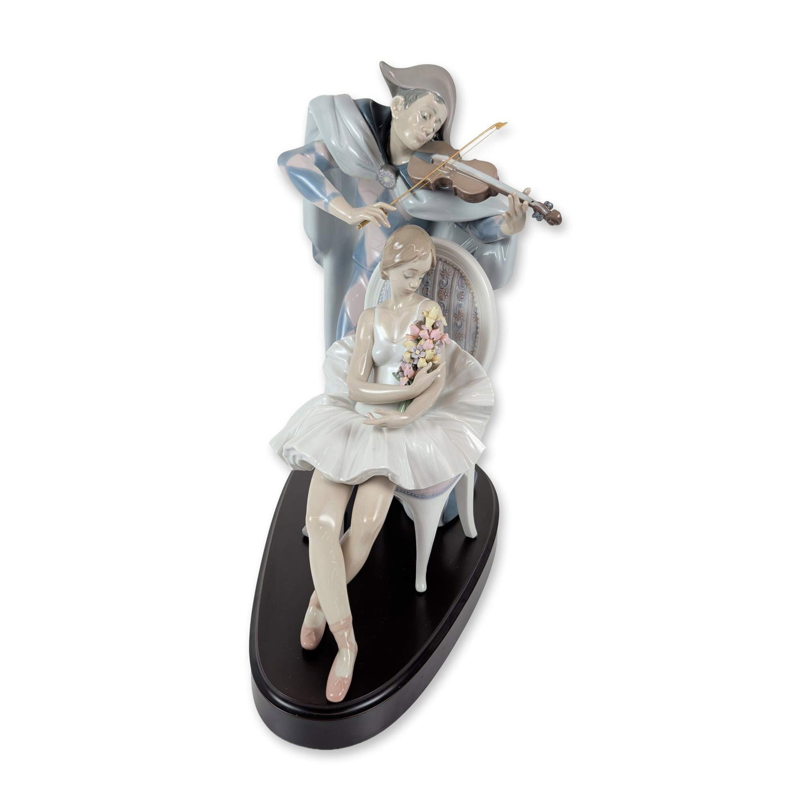 Lladro Jesters Serenade Porcelain Figurine: Large glossy porcelain figurine titled Jesters Serenade, reference number 5932. The composition features a seated ballerina in a white tutu holding a bouquet of pink and yellow flowers, with a jester 