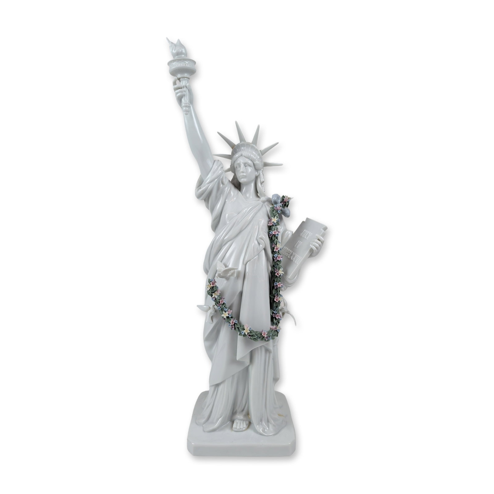Lladro Porcelain Sculpture of the Statue of Liberty 1007563: Large-scale glazed porcelain sculpture depicting the Statue of Liberty, featuring the iconic seven-rayed crown, raised torch, and tablet inscribed JULY IV MDCCLXXVI. The figure is draped with a polych